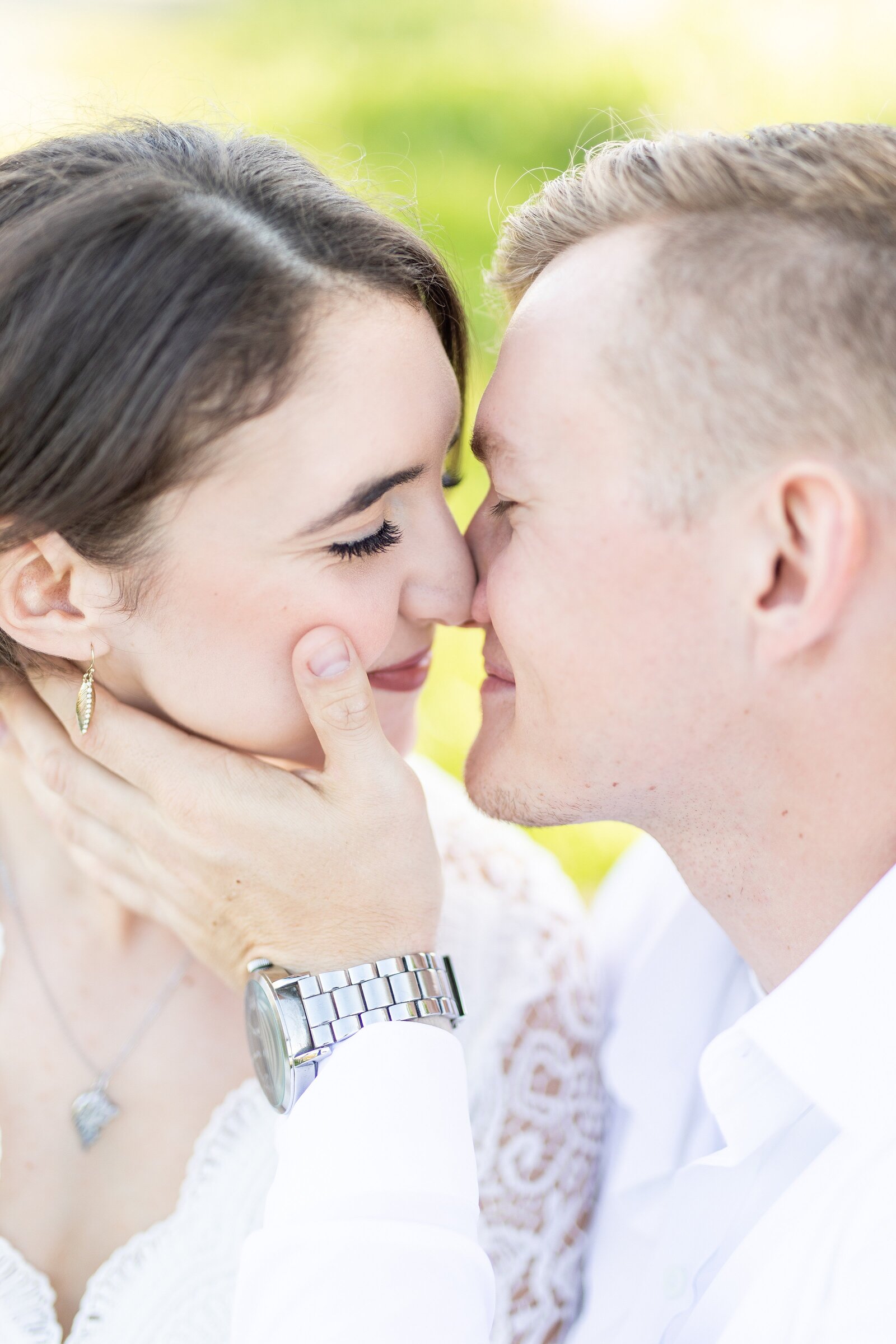 Couple before kissing for engagement session.