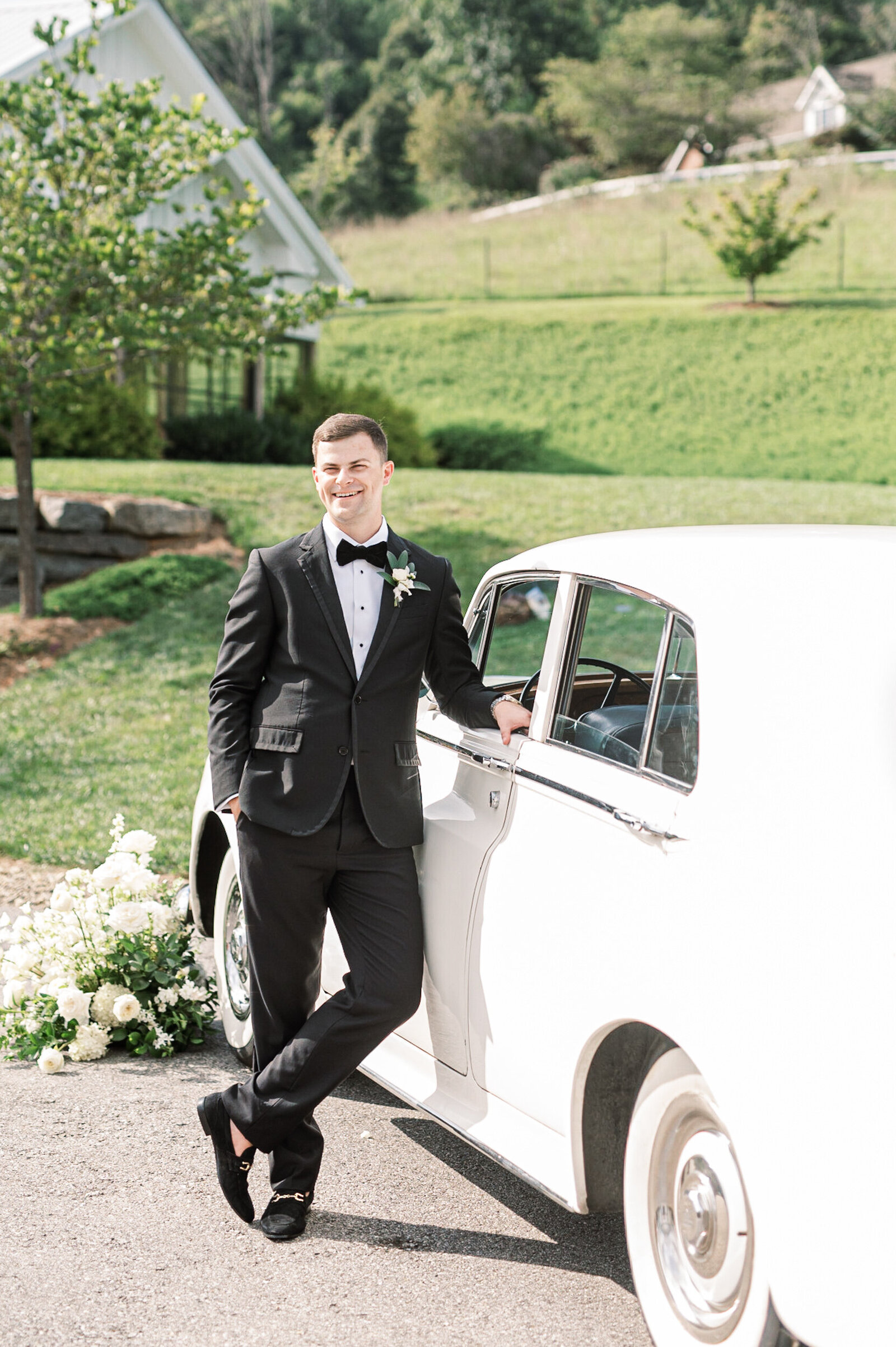 groom with Rolls Royce elegant summer mountain wedding Chestnut Ridge Asheville NC
