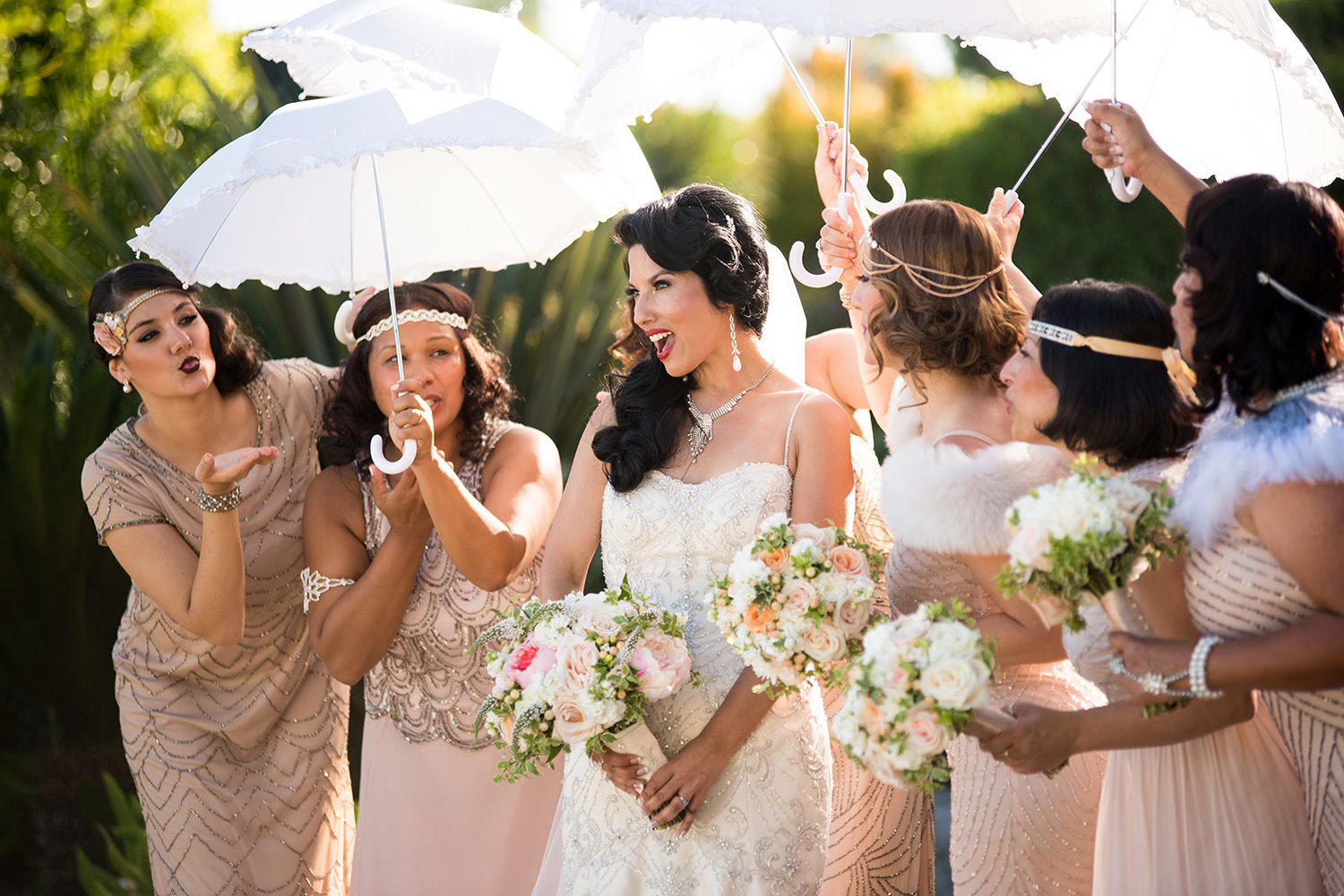Creative bridesmaids portrait with parasols