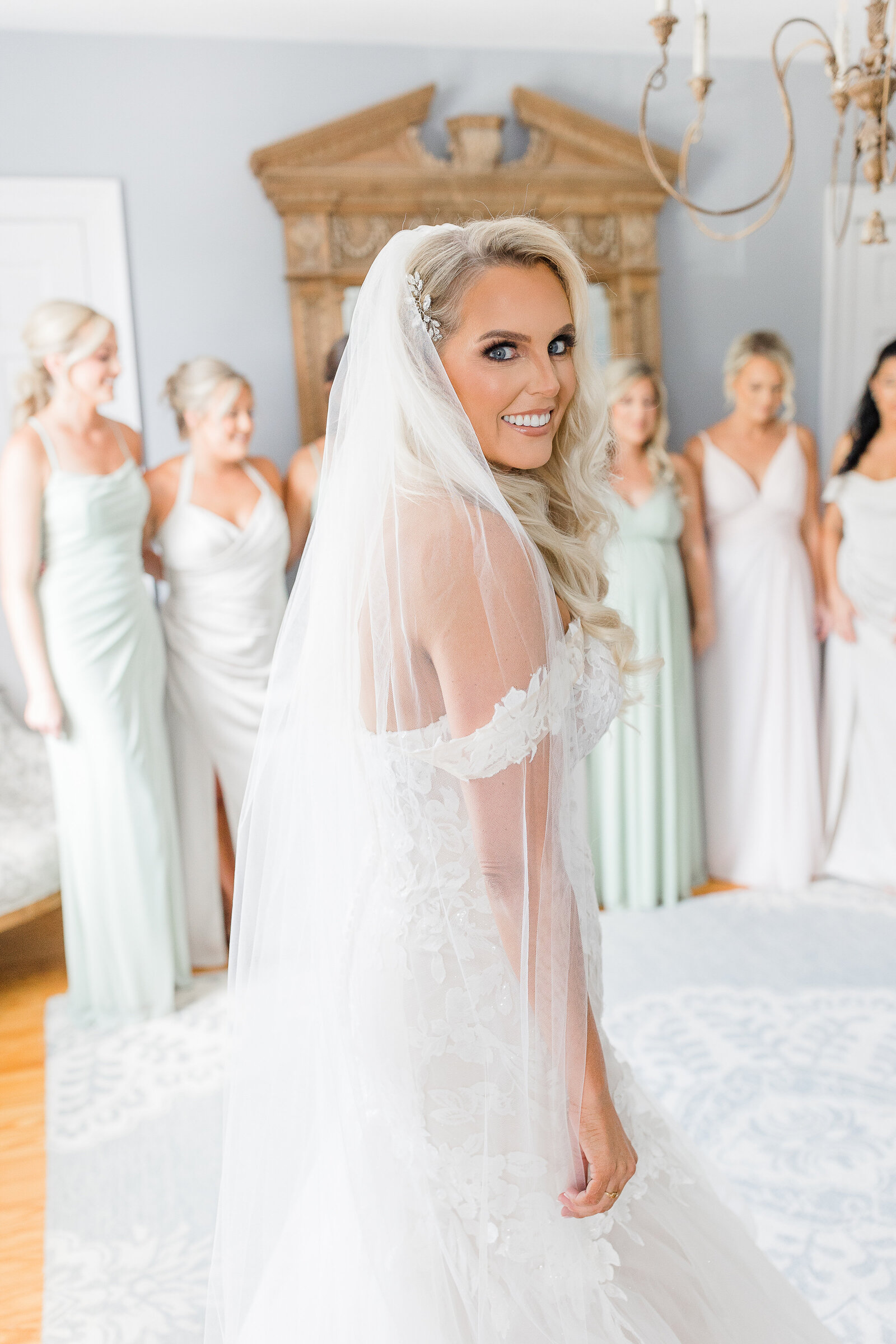 Bride first look with bridesmaids at Stone House of st. Charles Bridal cottage