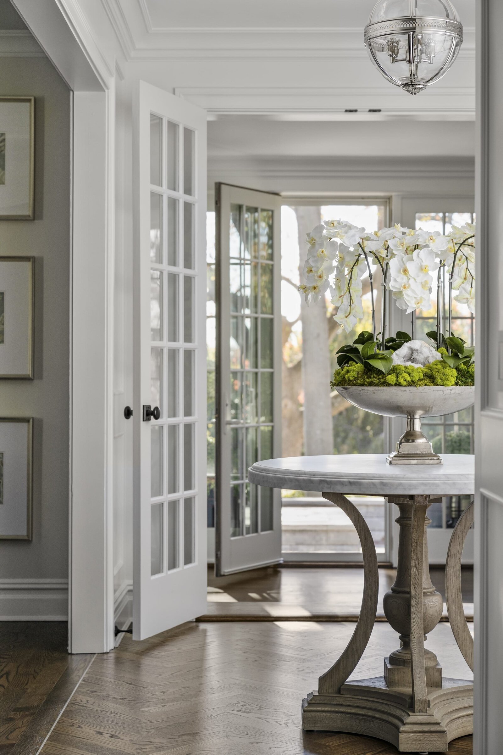 candra lynn interiors ocean port project entryway table with white orchid