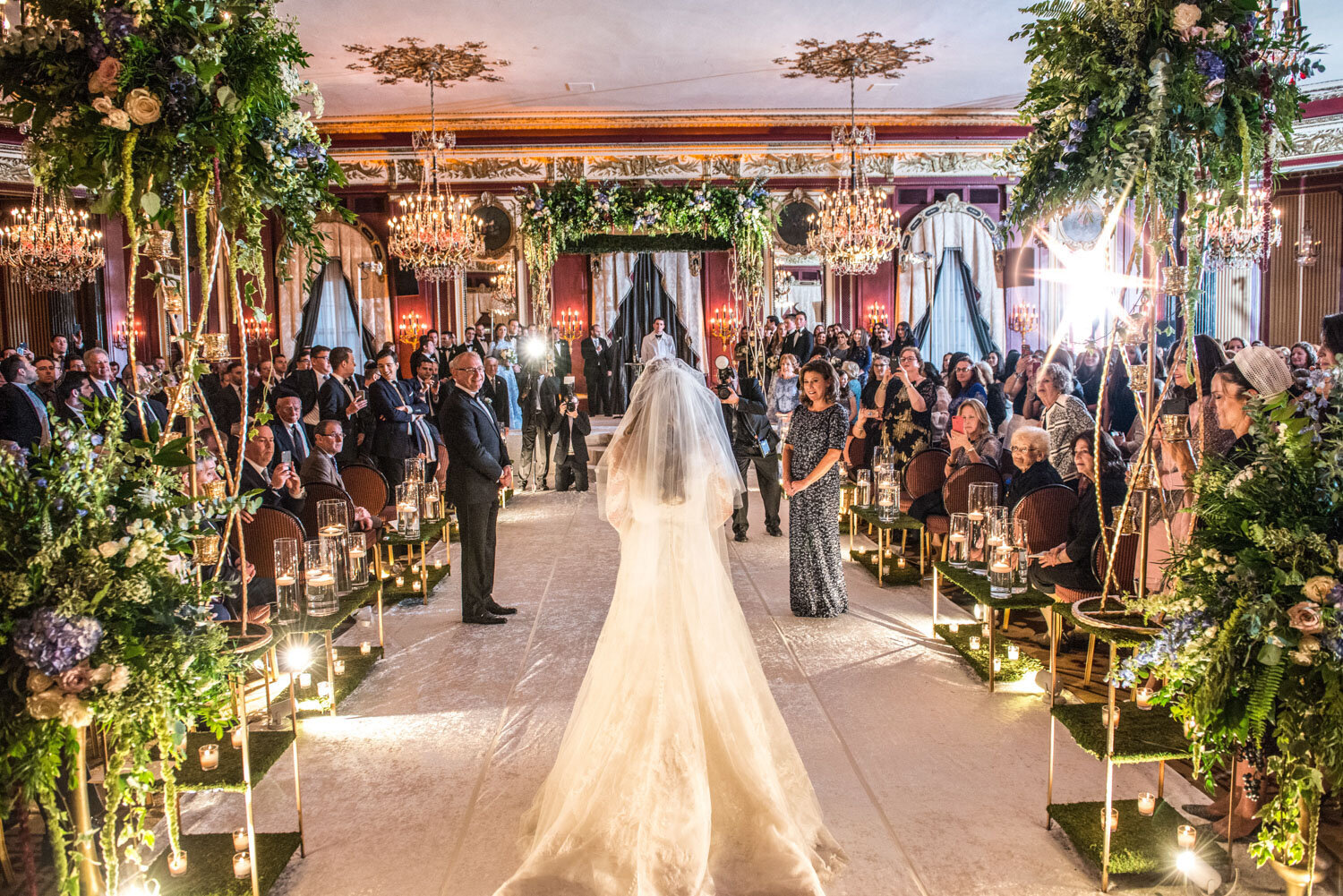 A bride and groom are walking down the aisle at their wedding