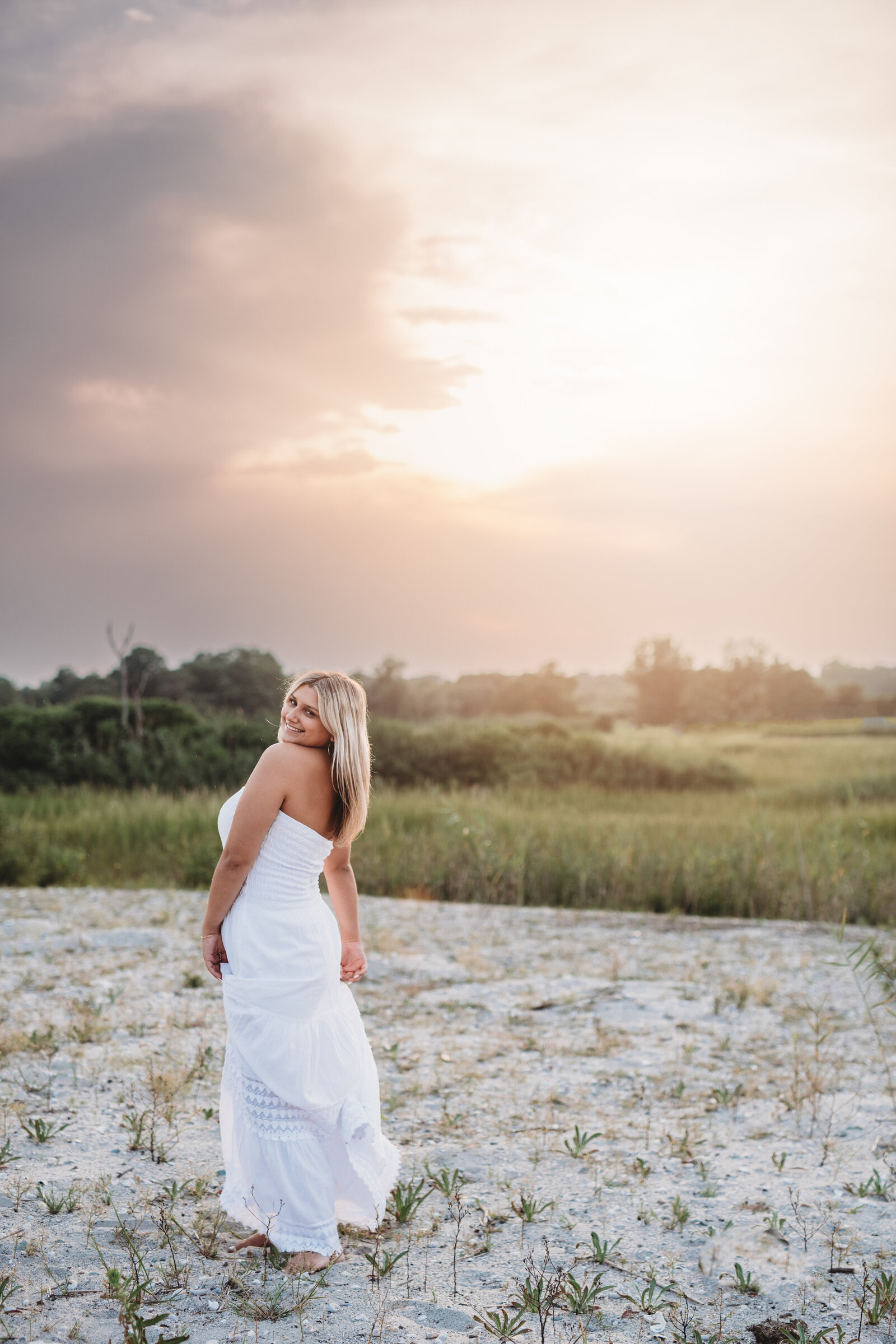 Capturing the beauty of golden hour in Milford, CT, this high school senior portrait session highlights natural elegance and confidence. Book your senior photoshoot in Connecticut today! Click here to request my High School Senior Magazine for details.