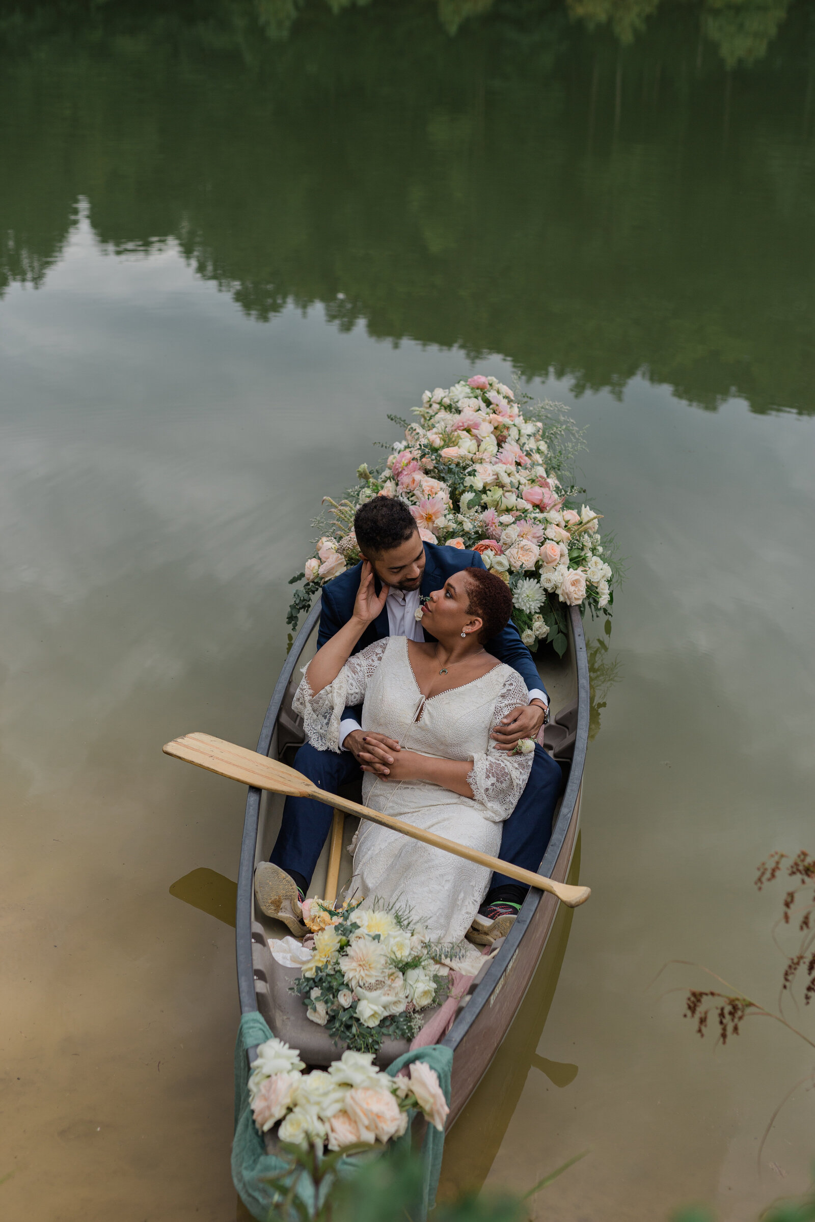 Black couple canoeing for their elopement day