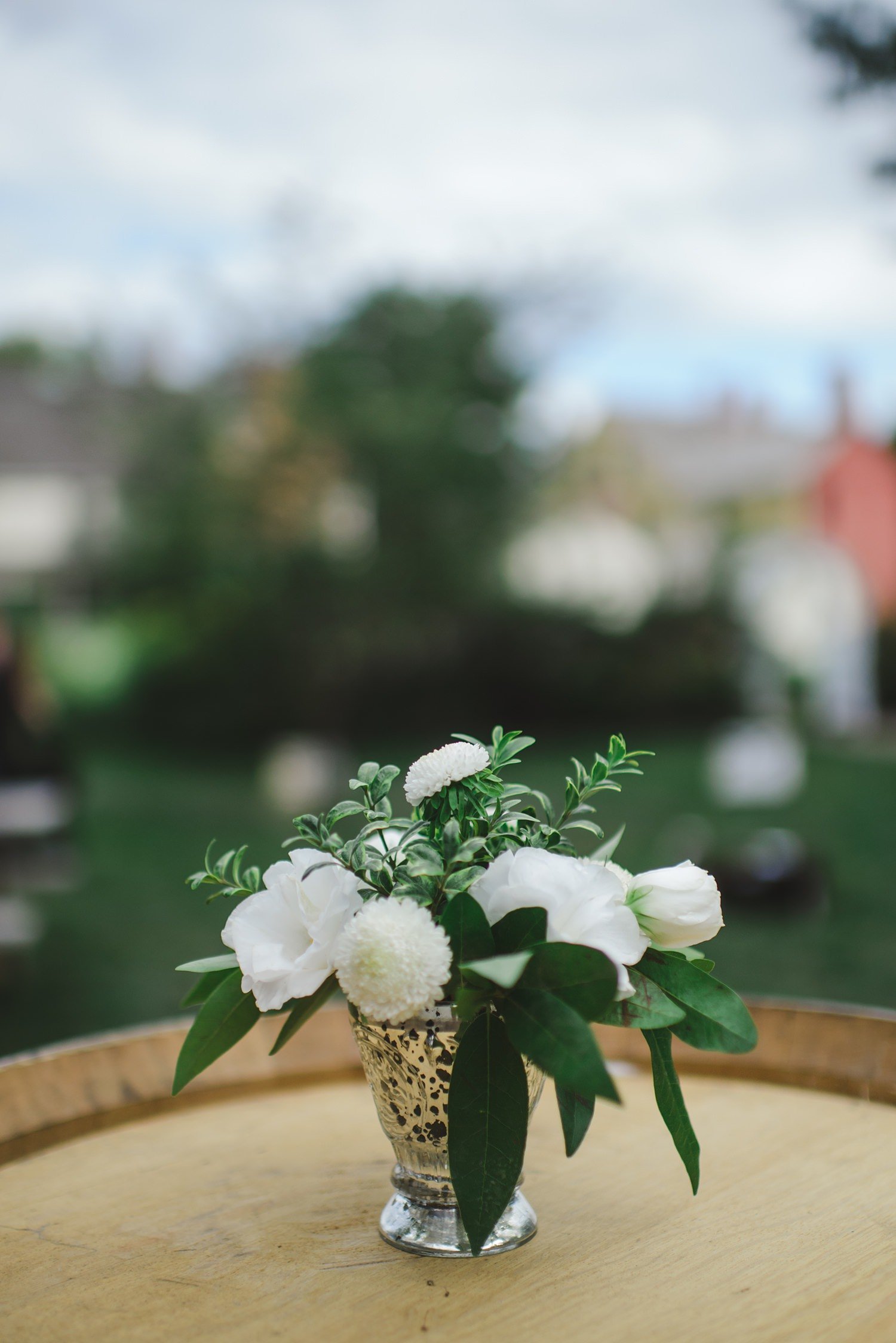 Webb Barn wedding cocktail tables with white flowers