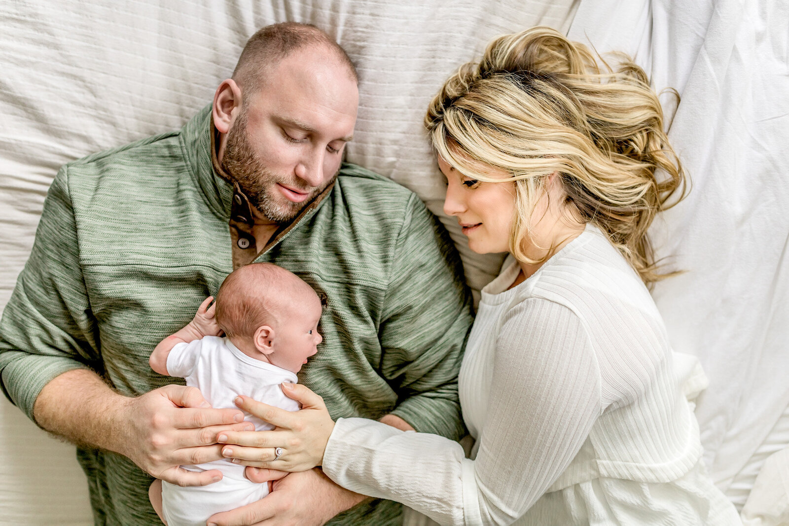 Newborn  baby sleeping on father