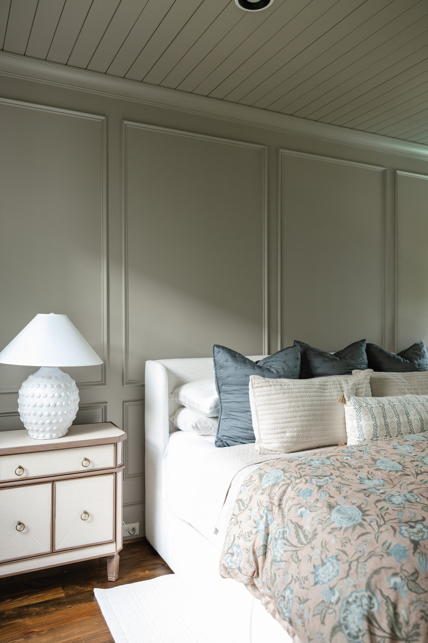 Elegant primary bedroom in Milton, Georgia designed by Megan Paterson Interiors, featuring soft neutral tones, layered textures, and a timeless aesthetic.