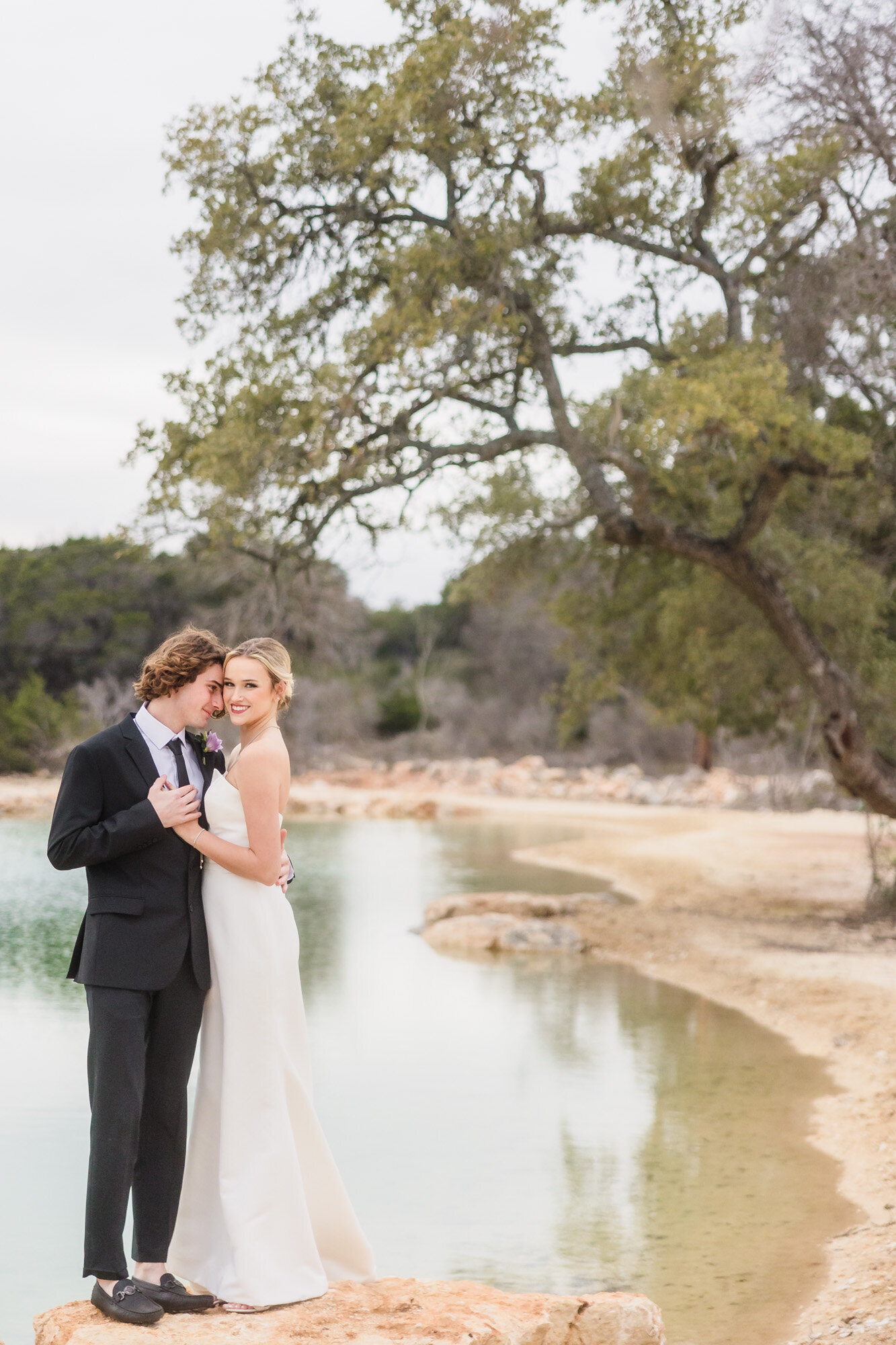 Bride and Groom Embrace at the Videre Estate wedding venue in Wimberley. Texas