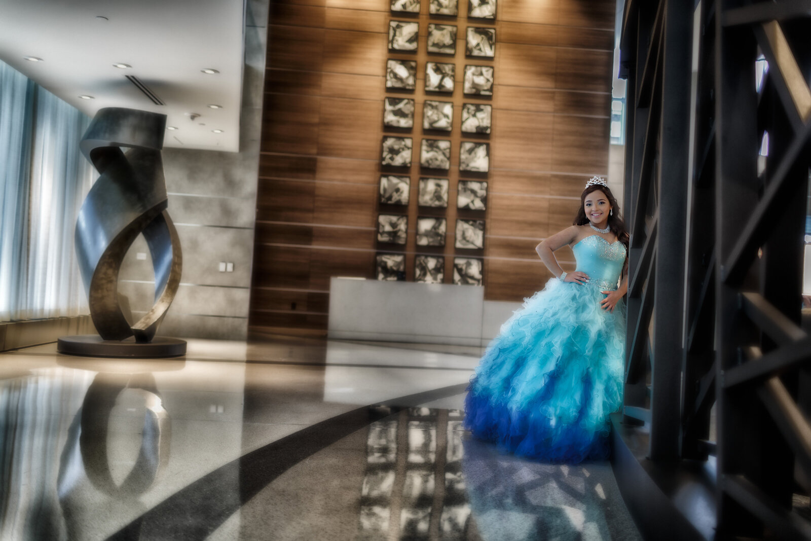 Yarelis posing gracefully on the grand staircase at Hilton Cleveland Downtown during her quinceañera photoshoot. Capturing timeless elegance in the heart of Cleveland, Ohio