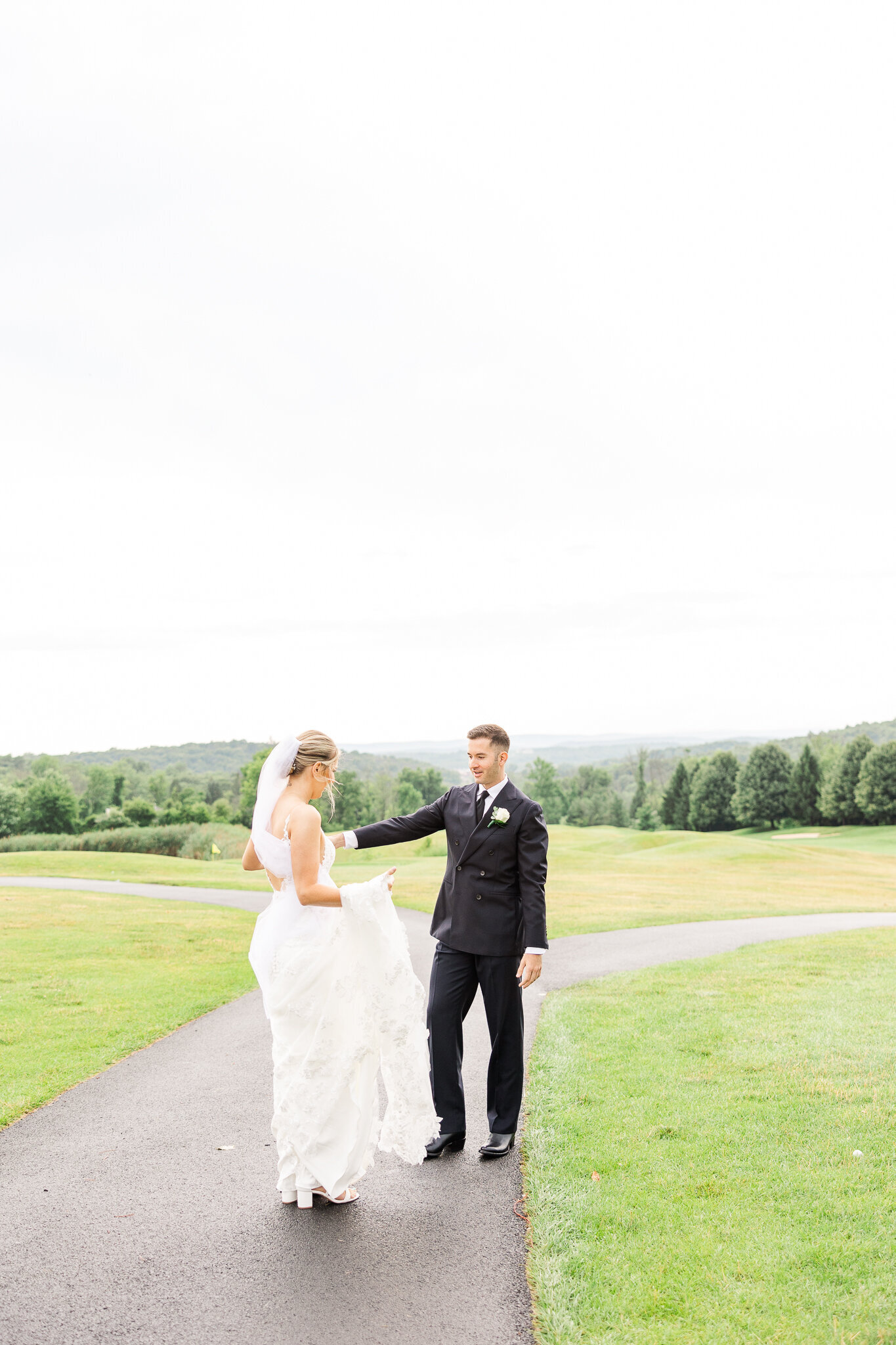 Groom spinning his bride playfully during their first look at SkyView Golf Club