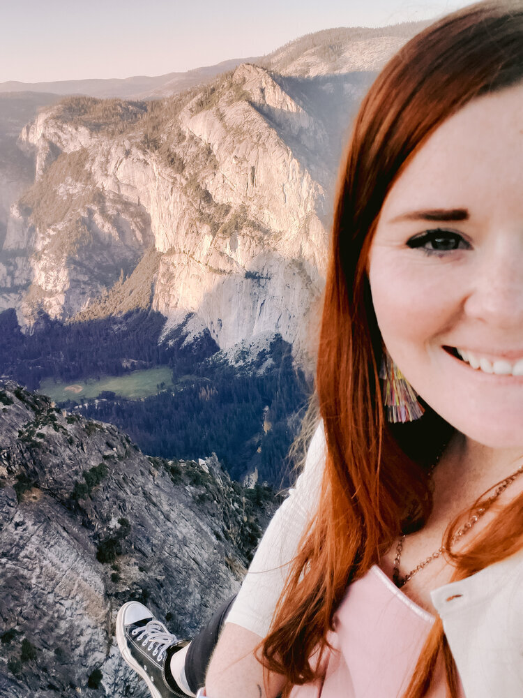 Sitting on ledge in Taft Point in Yosemite National Park