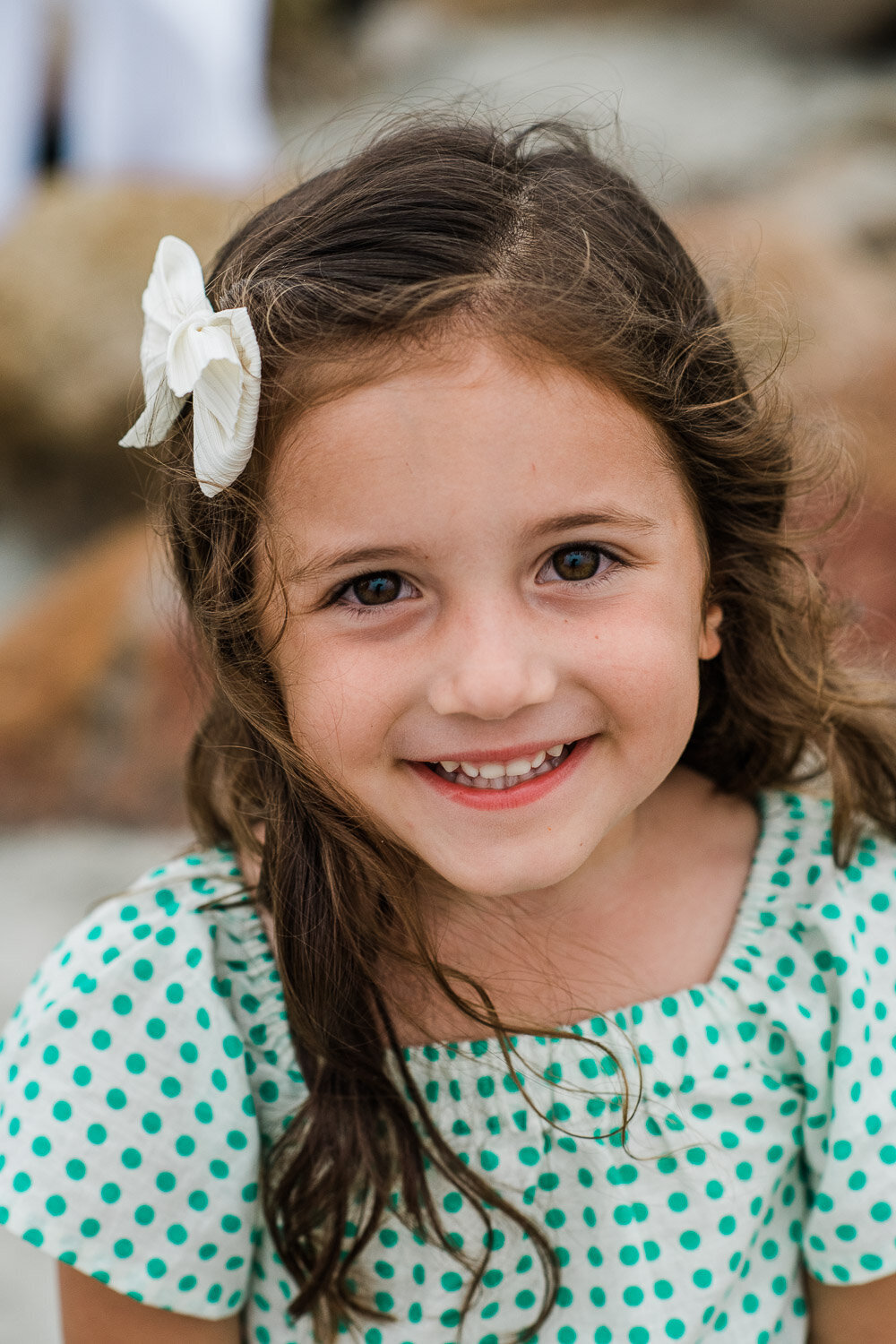 toddler girl close up at beach