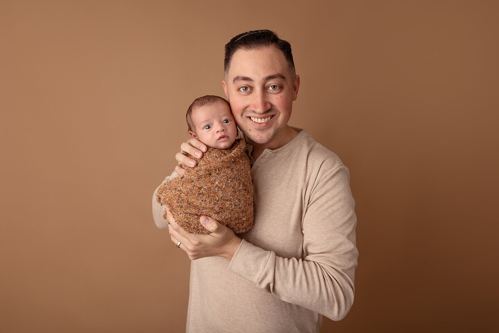 dad posing with baby by Newborn Photography Bucks County PA