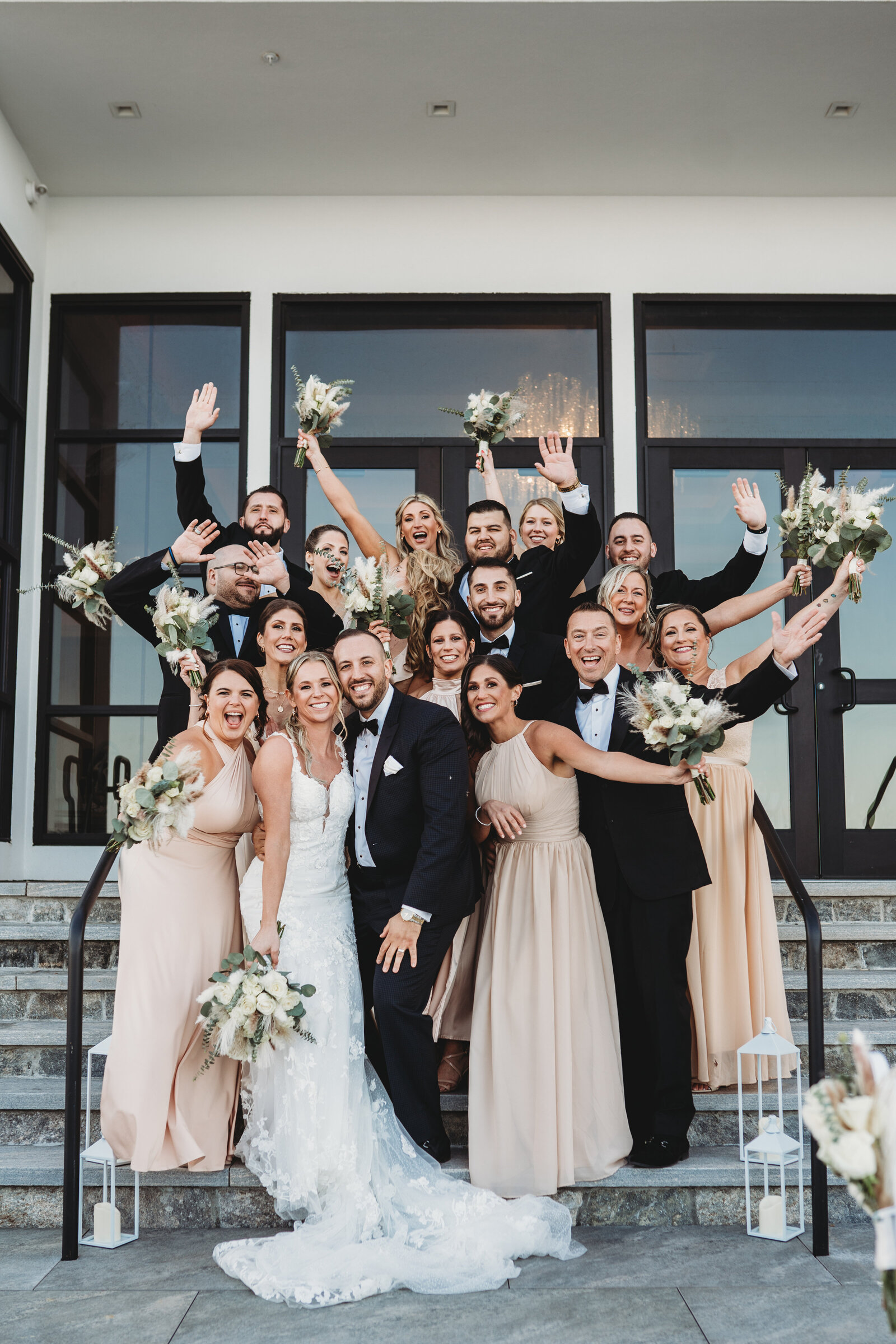 A fun and energetic wedding party celebration at Tyde, a premier waterfront wedding venue in Connecticut. This stunning wedding group photo captures love, laughter, and the perfect backdrop for a memorable celebration. Ideal for couples looking for a modern, elegant venue with breathtaking views.