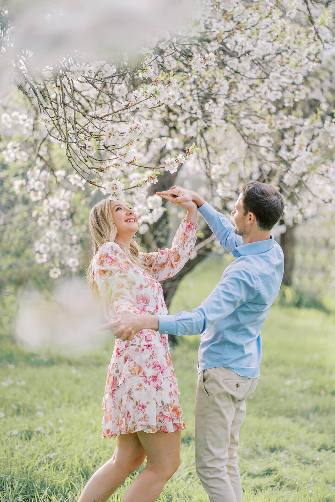 Couple embracing the romance of the season with our dreamy almond blossom photoshoot experience in Adelaide.