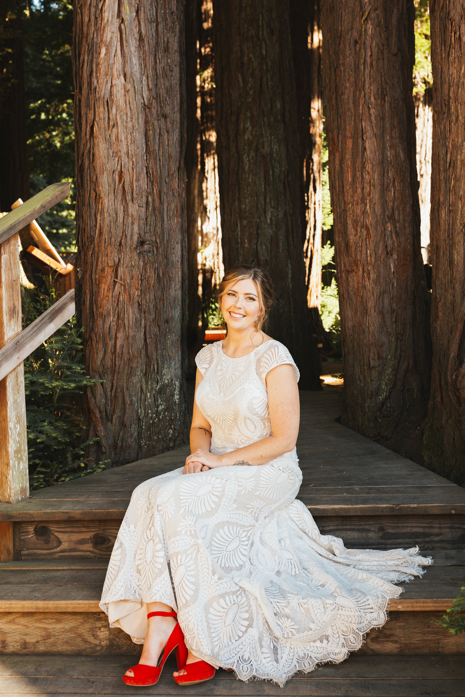 Bride on her colorful wedding day in Santa Cruz, California in the redwood trees.