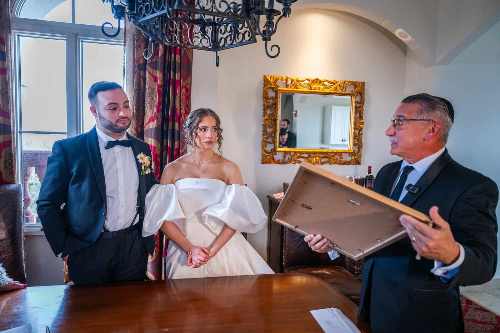 Rabbi explaining the meaning of the Ketubah at jewish wedding - Casa Monica Wedding venue in St Augustine