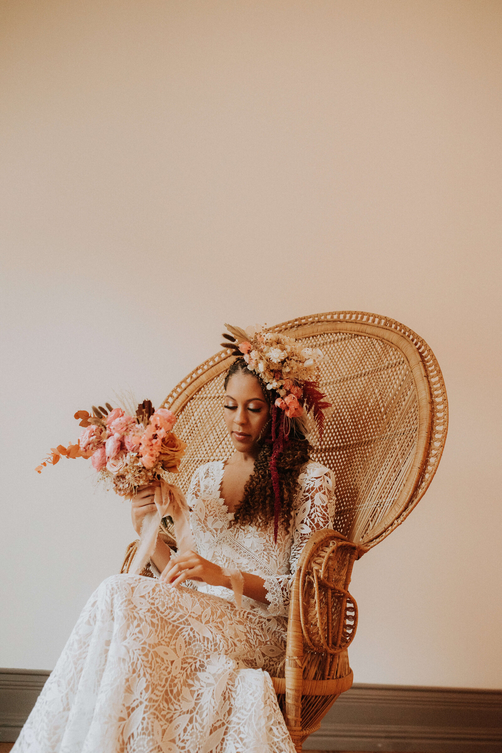 bride in gown by Lovelist Bridal and boho floral hat