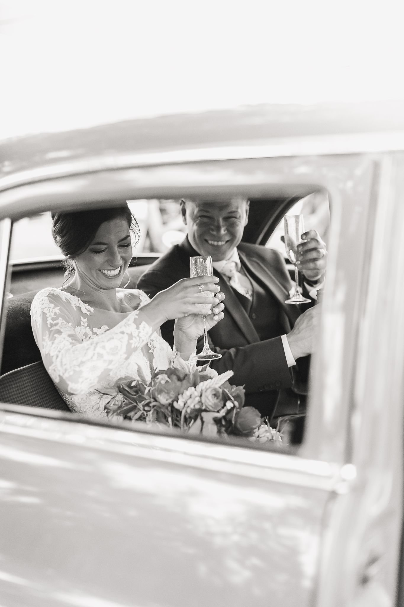 Candid black and white photo by Emi Rose Studio, wedding photographer in Maine