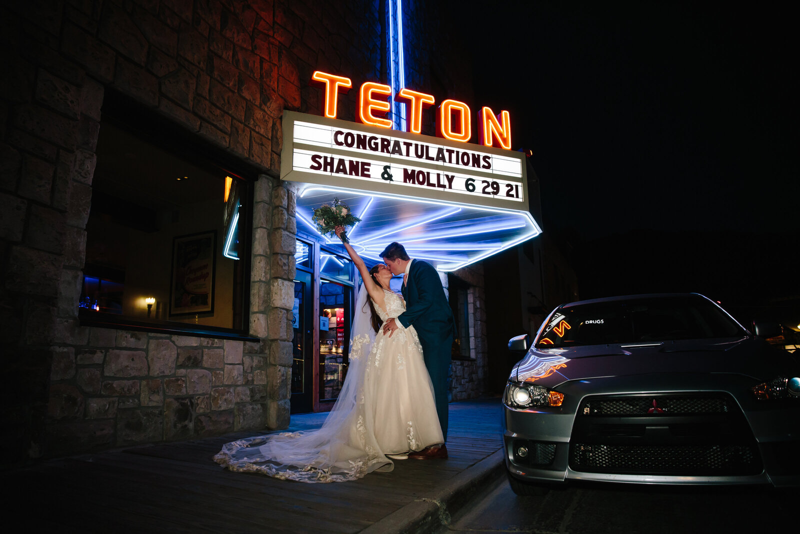 Jackson hole photographer captures bride and groom outside of Teton Pizza in Jackson Hole to celebrate their wedding