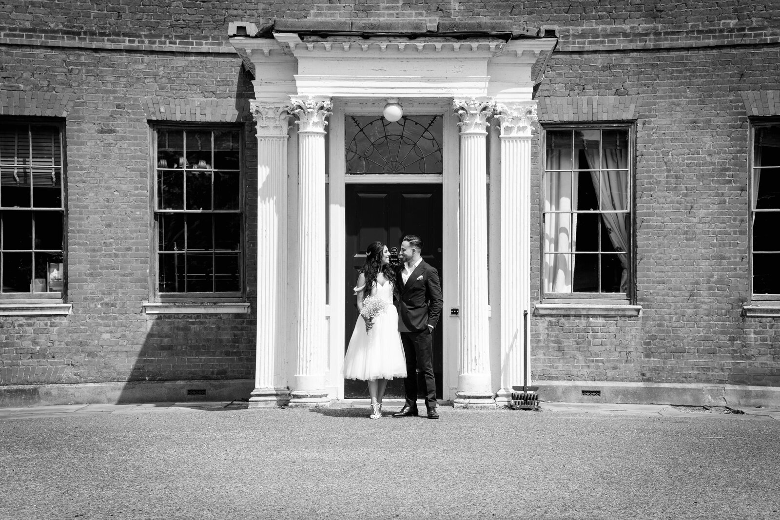 Wedding Photographer based in London capturing a candid laugh between the bride and groom.