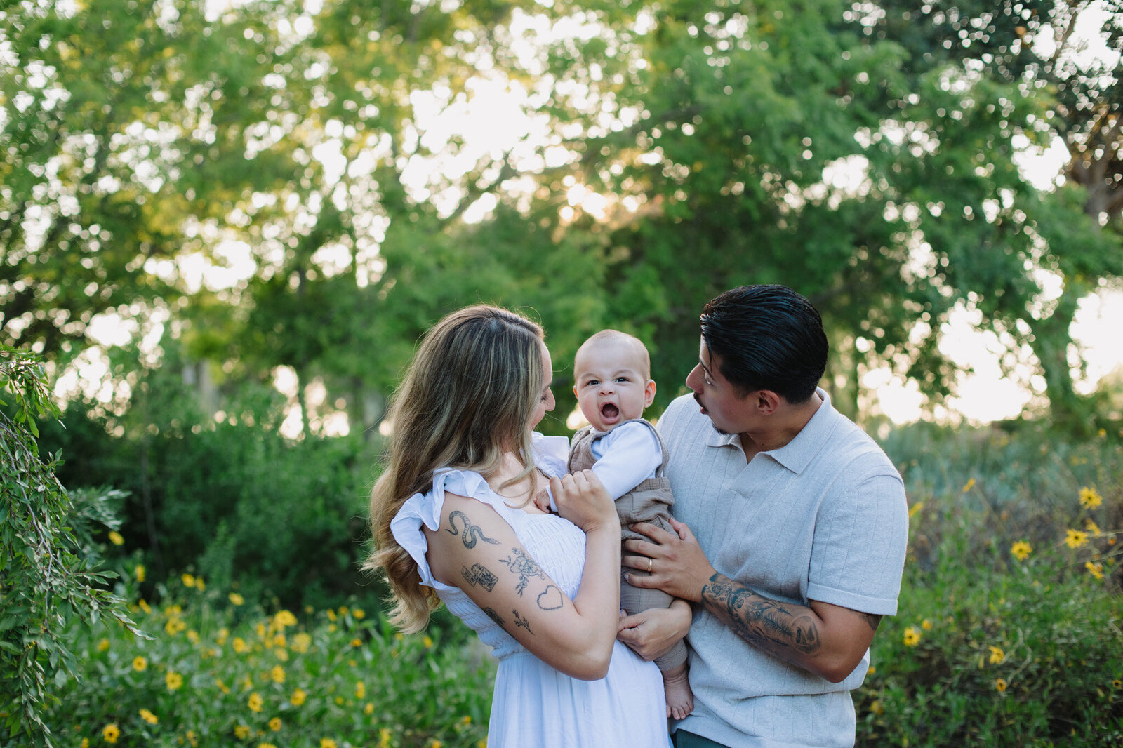 Family of three in Willow Springs Park during golden hour