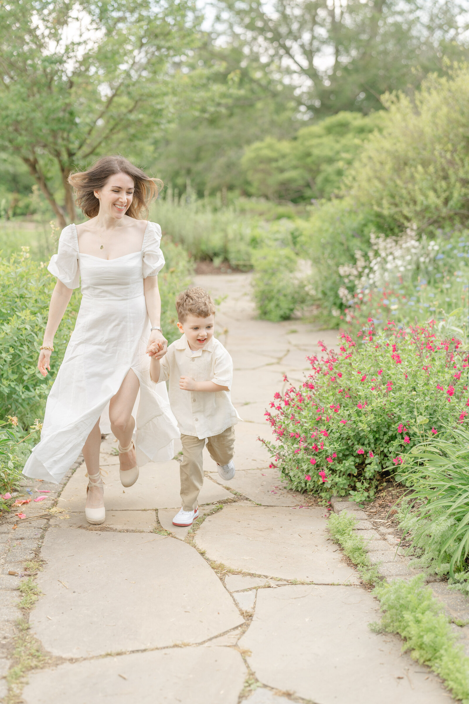mom and son running at a garden in Chantilly, VA