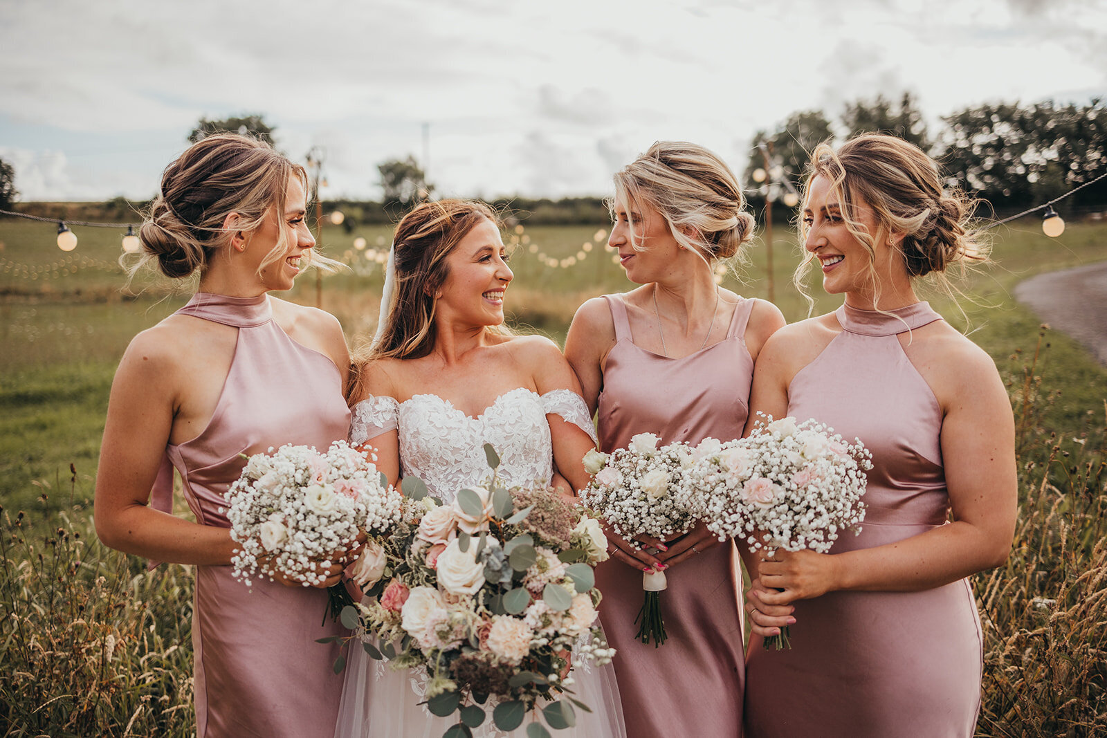 bride poses with bridesmaids