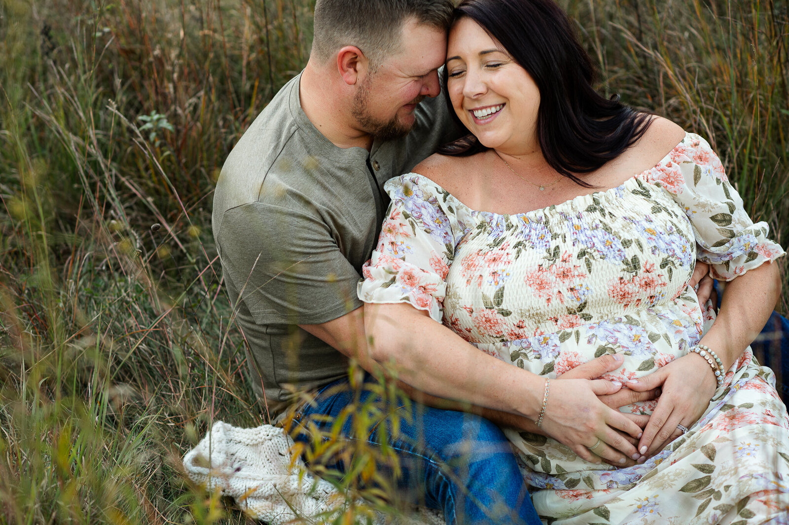 Couple smiling maternity outdoor park