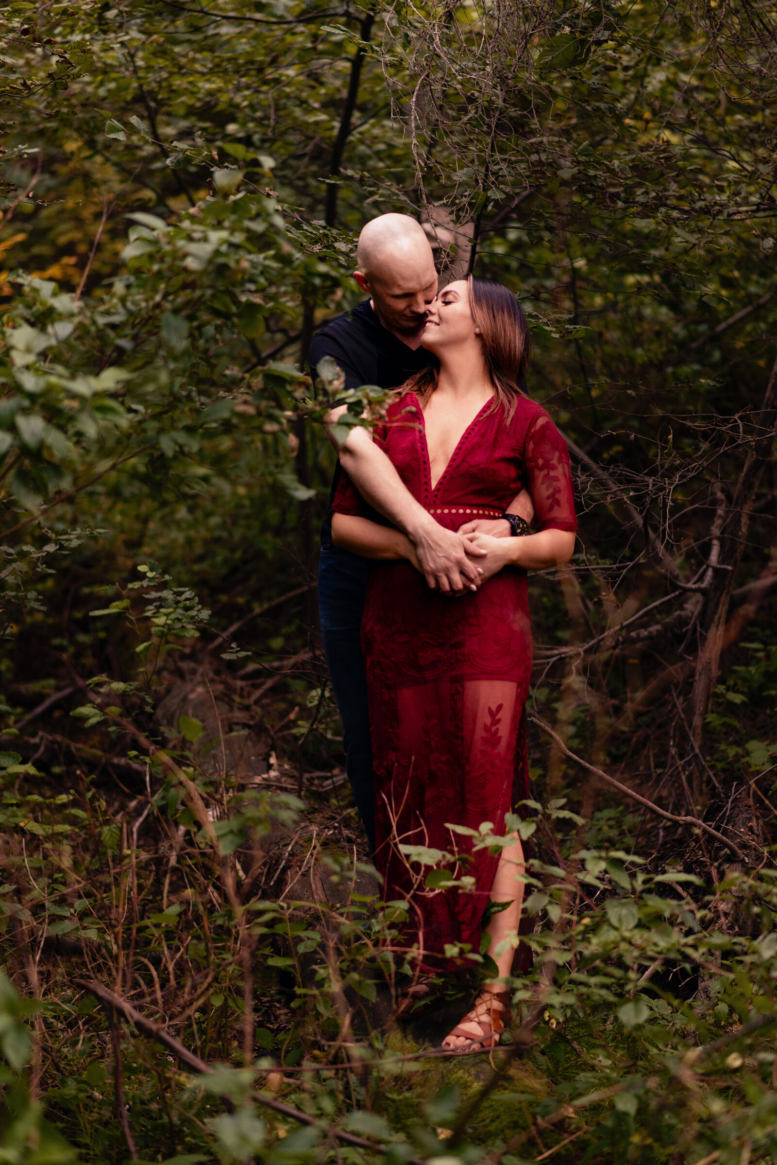 couple with red dress  in woods