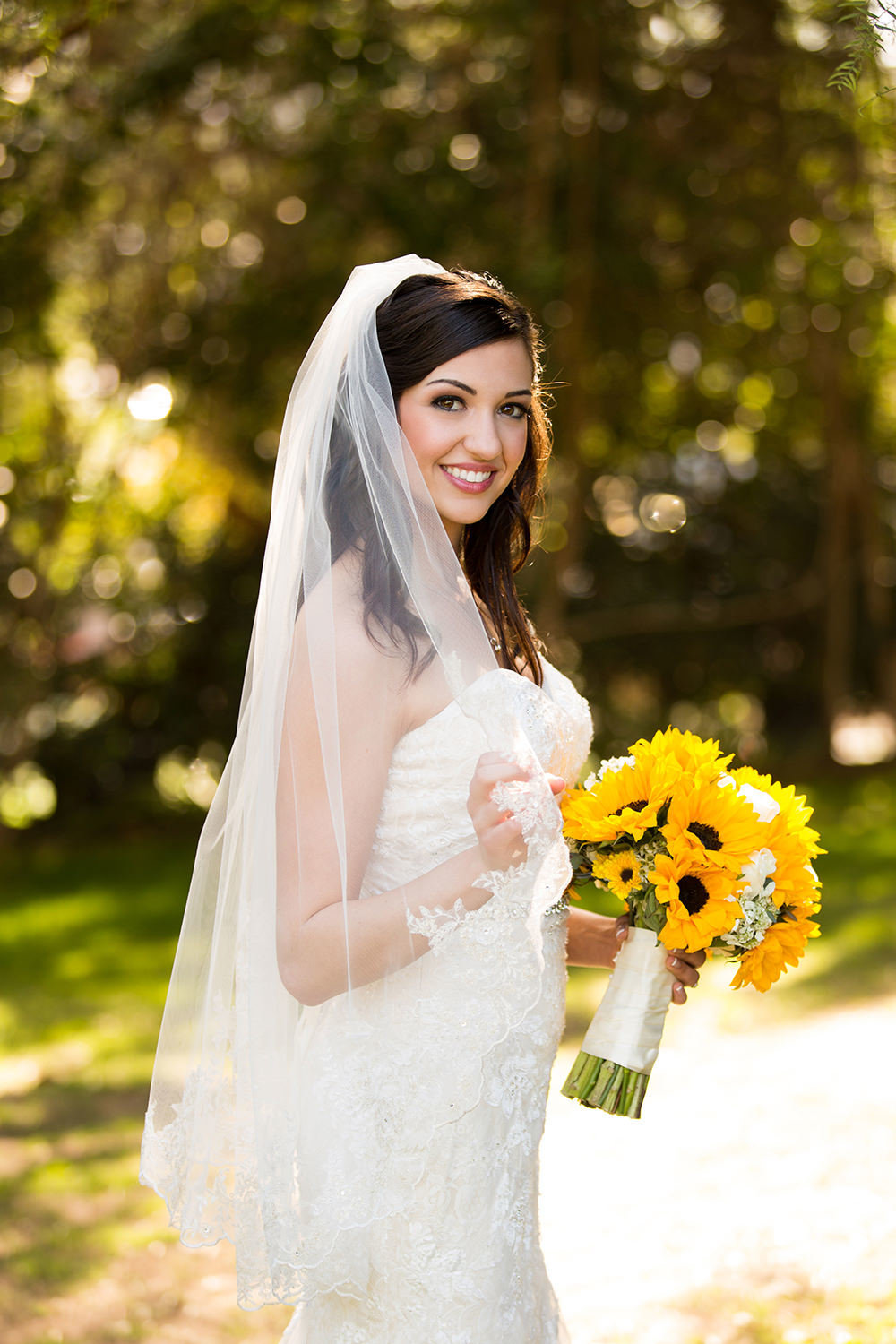 Classic bridal portrait with bright sunflower bouquet