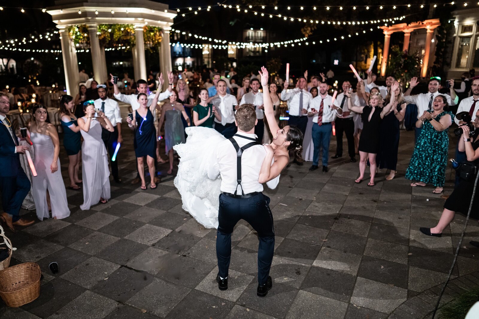 Groom lifts bride during Elms Mansion wedding reception