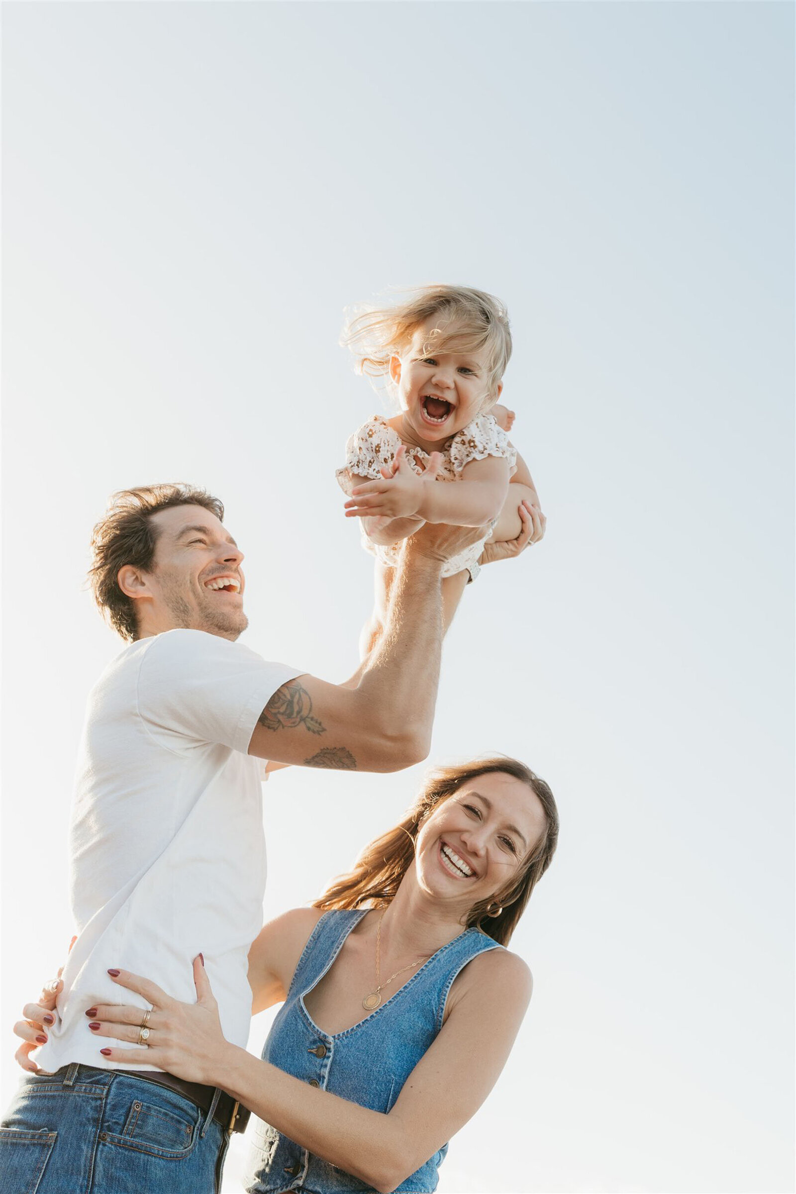 Editorial-style family beach portraits in Maui, showcasing coordinated outfits and natural ocean light.