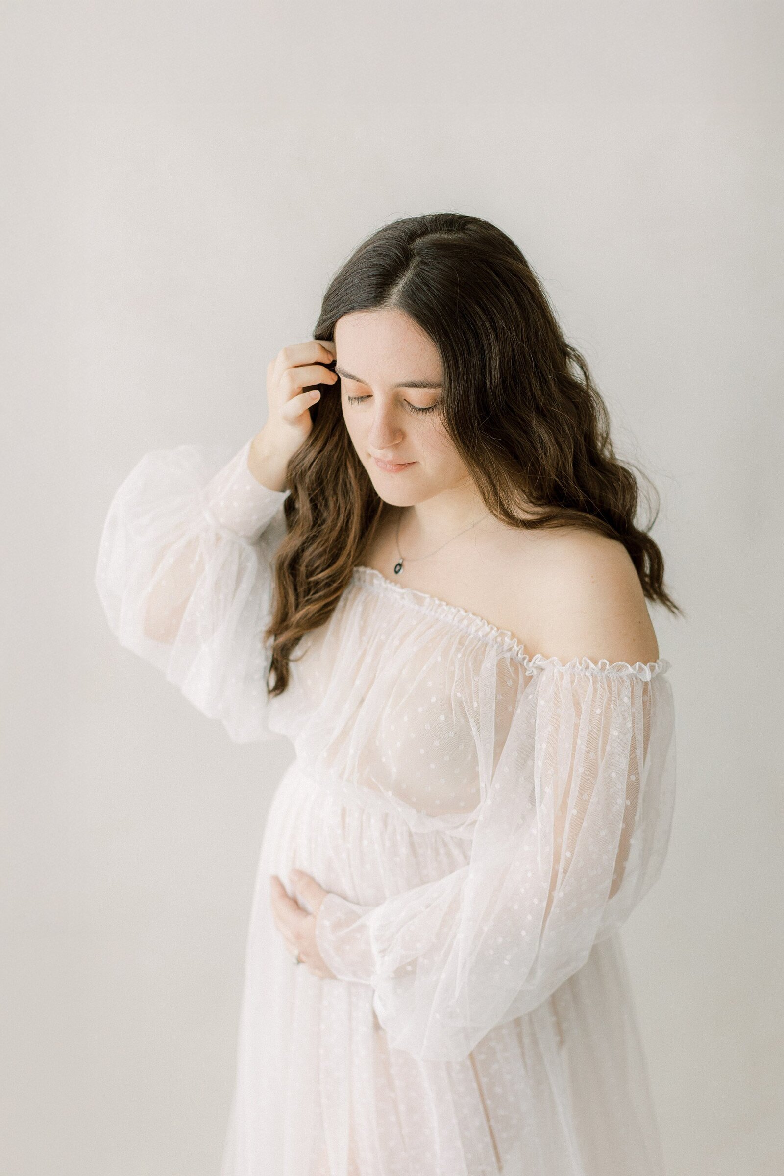 intimate maternity session in Lancaster, PA with tulle dresses and lace