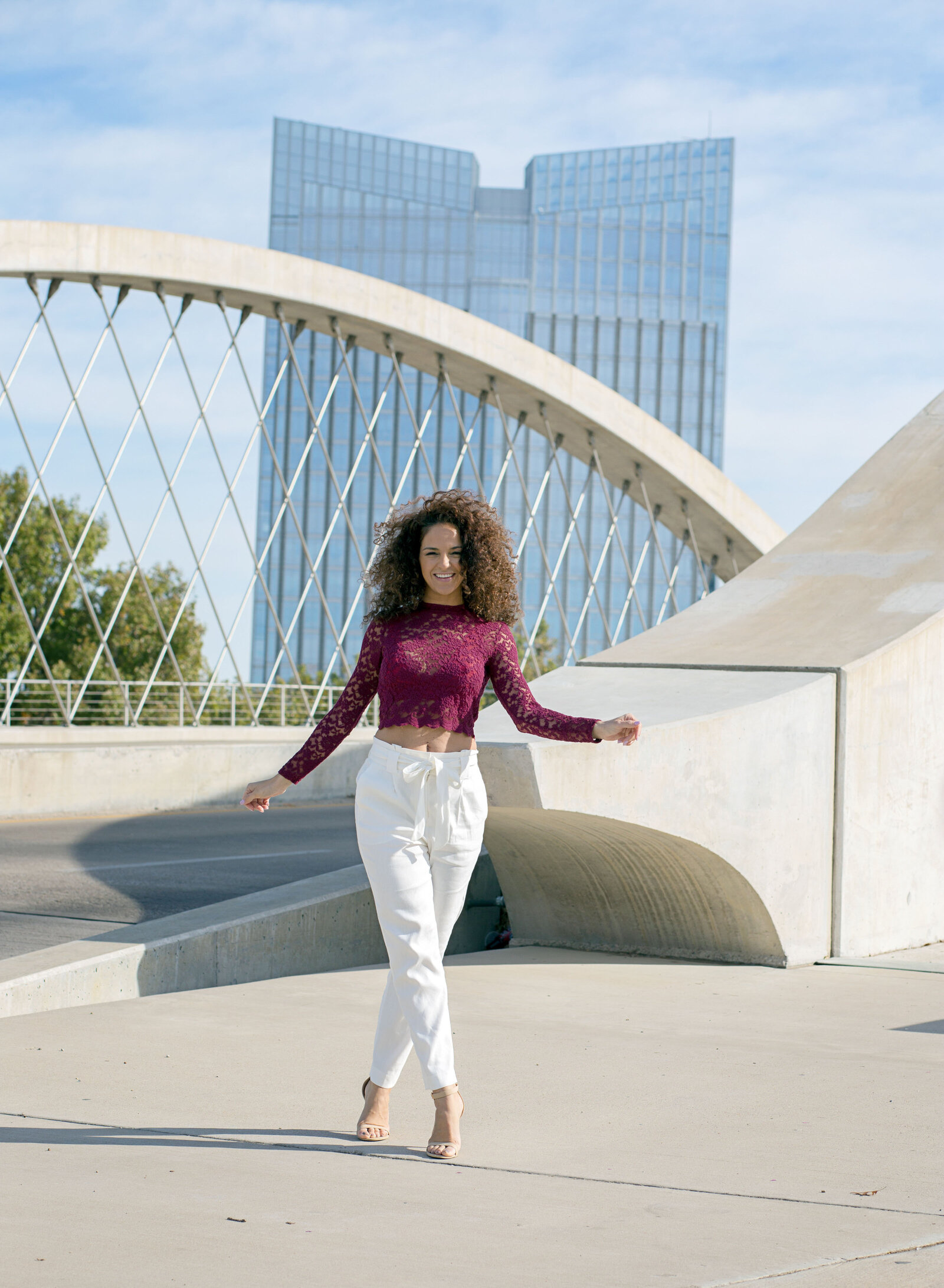 woman in front of bridge