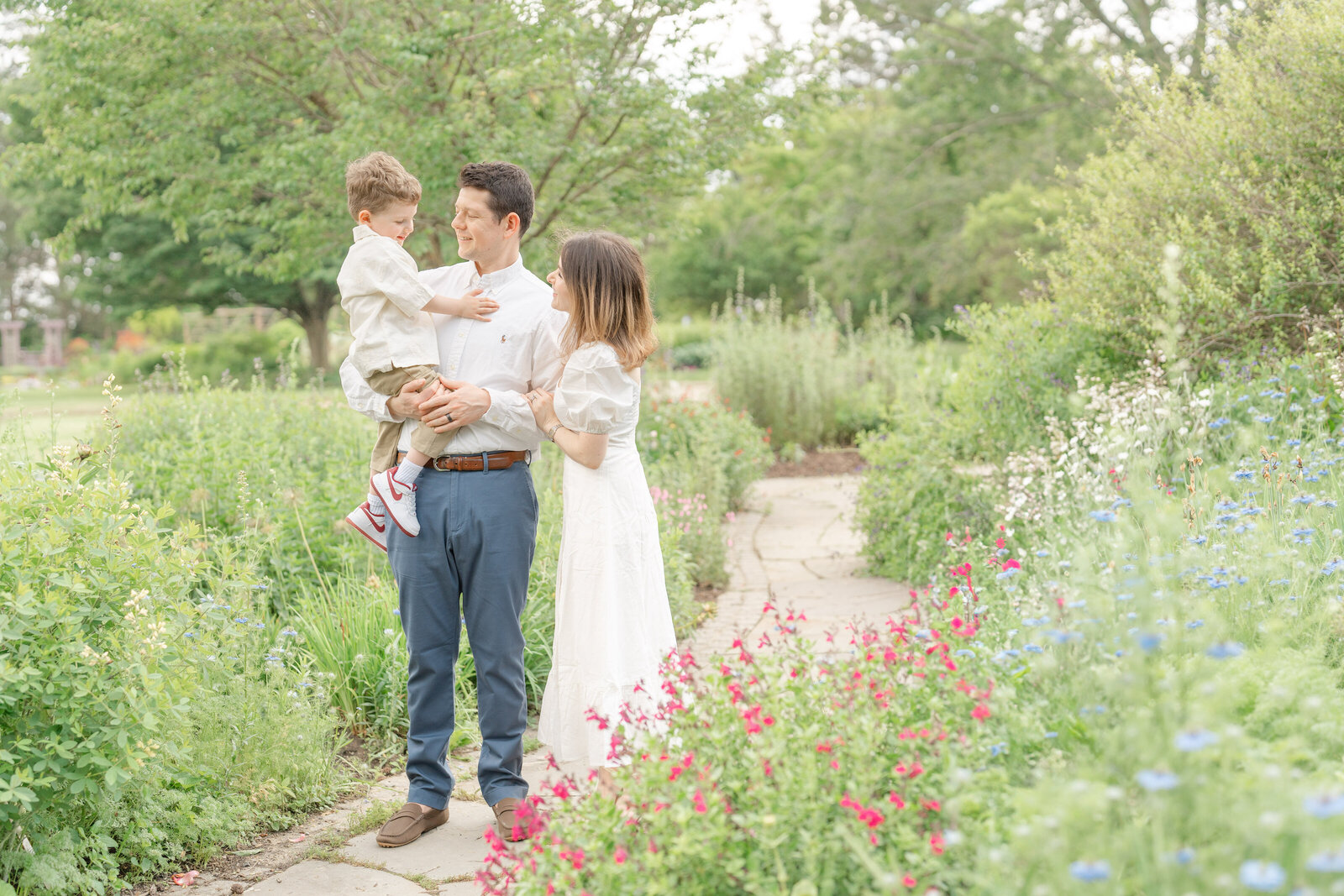 family playing at a garden during family picture in Chantilly, VA
