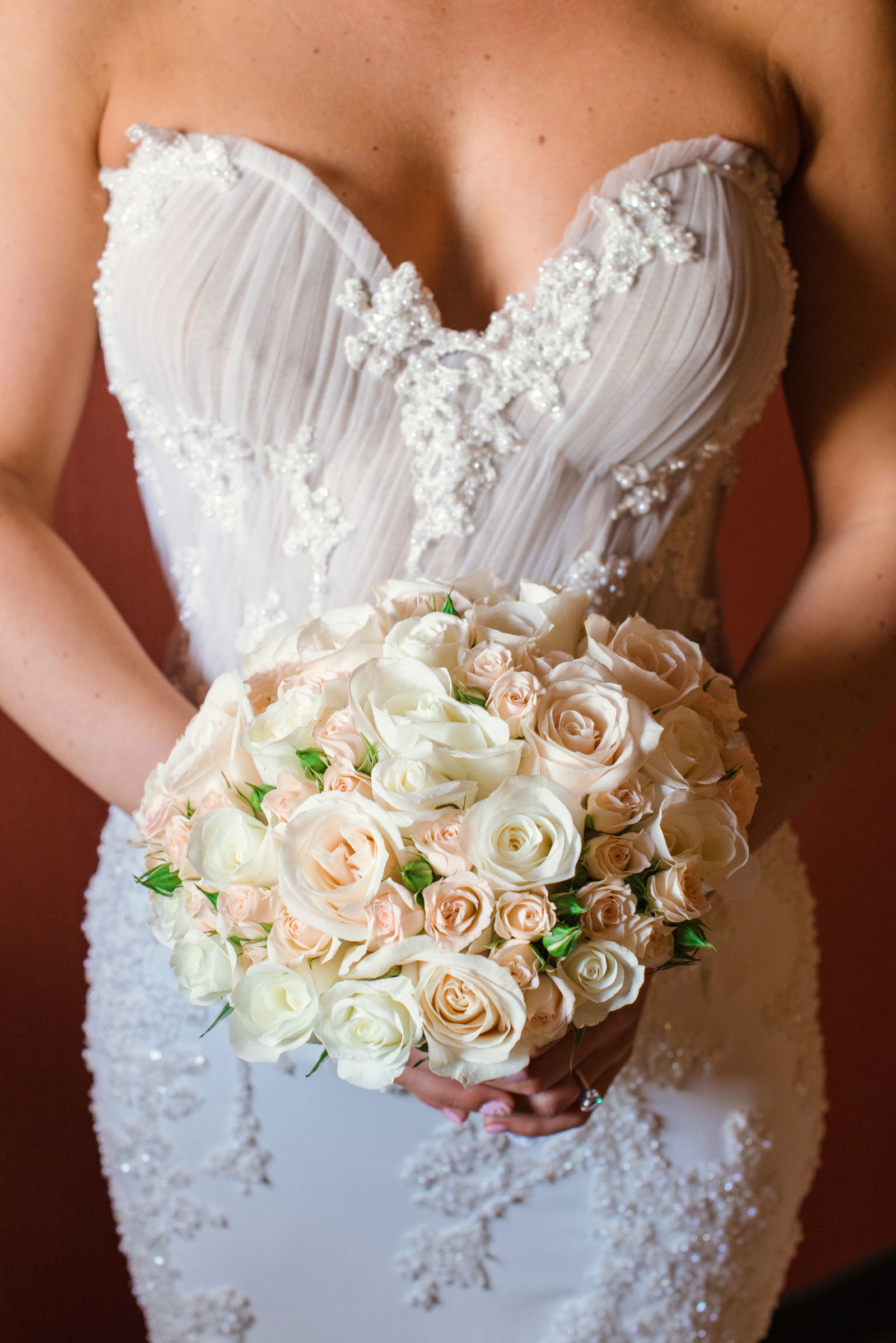 bride's gown and bouquet at Glen Head Country Club