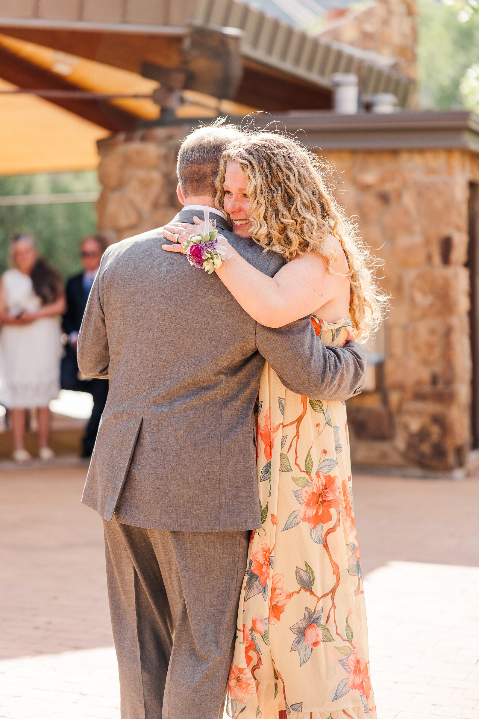 Groom sharing a heartfelt dance with his mother during the wedding reception at Ridgway State Park