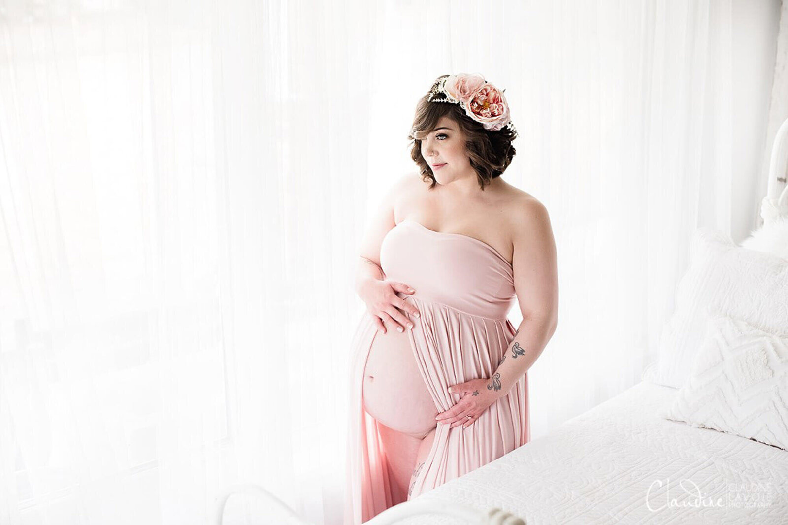 Maternity photo shoot with pink strapless dress and flower halo