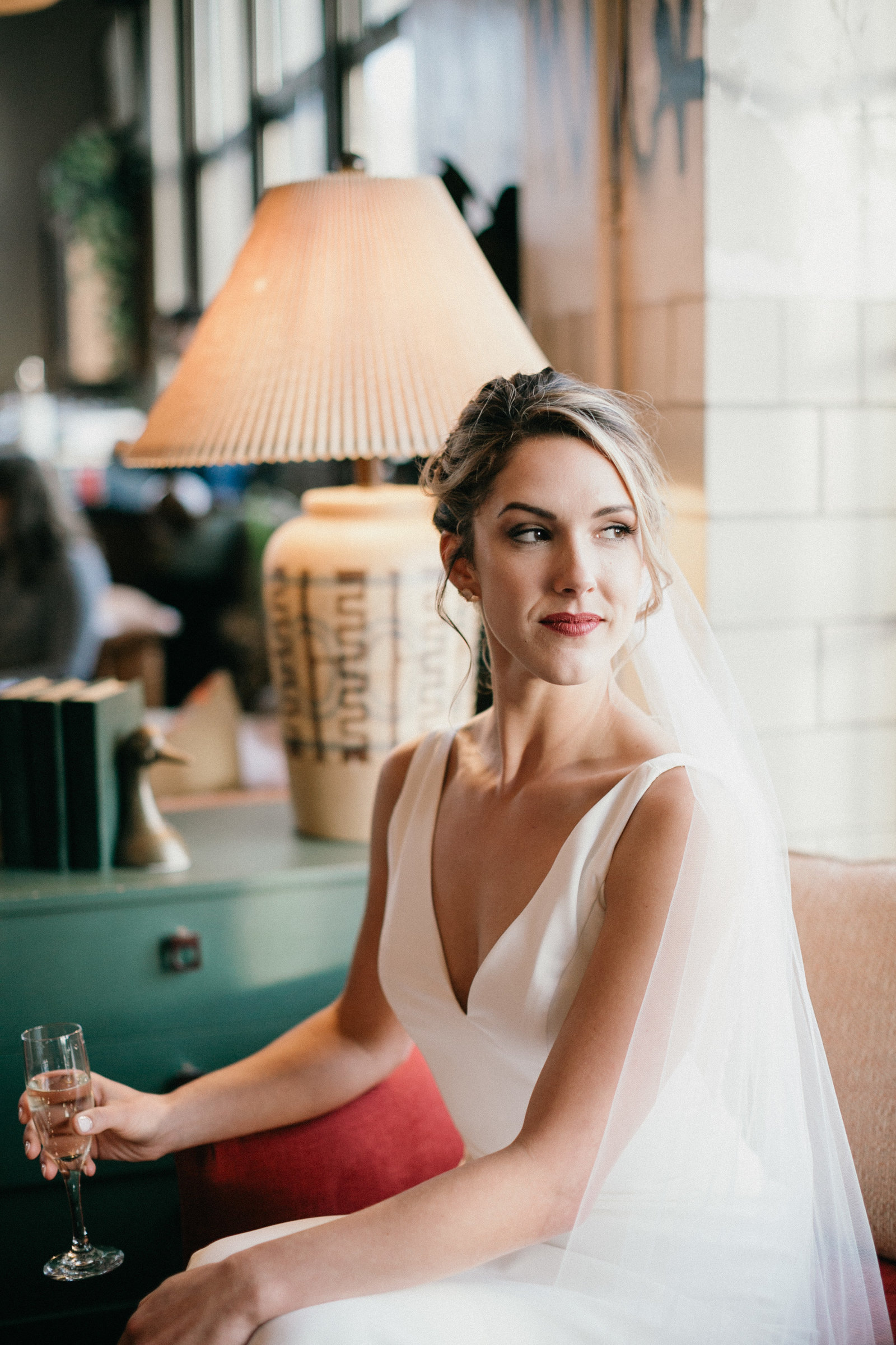 The gorgeous bride sitting pretty with a glass of champagne at Irwin's in Bok.