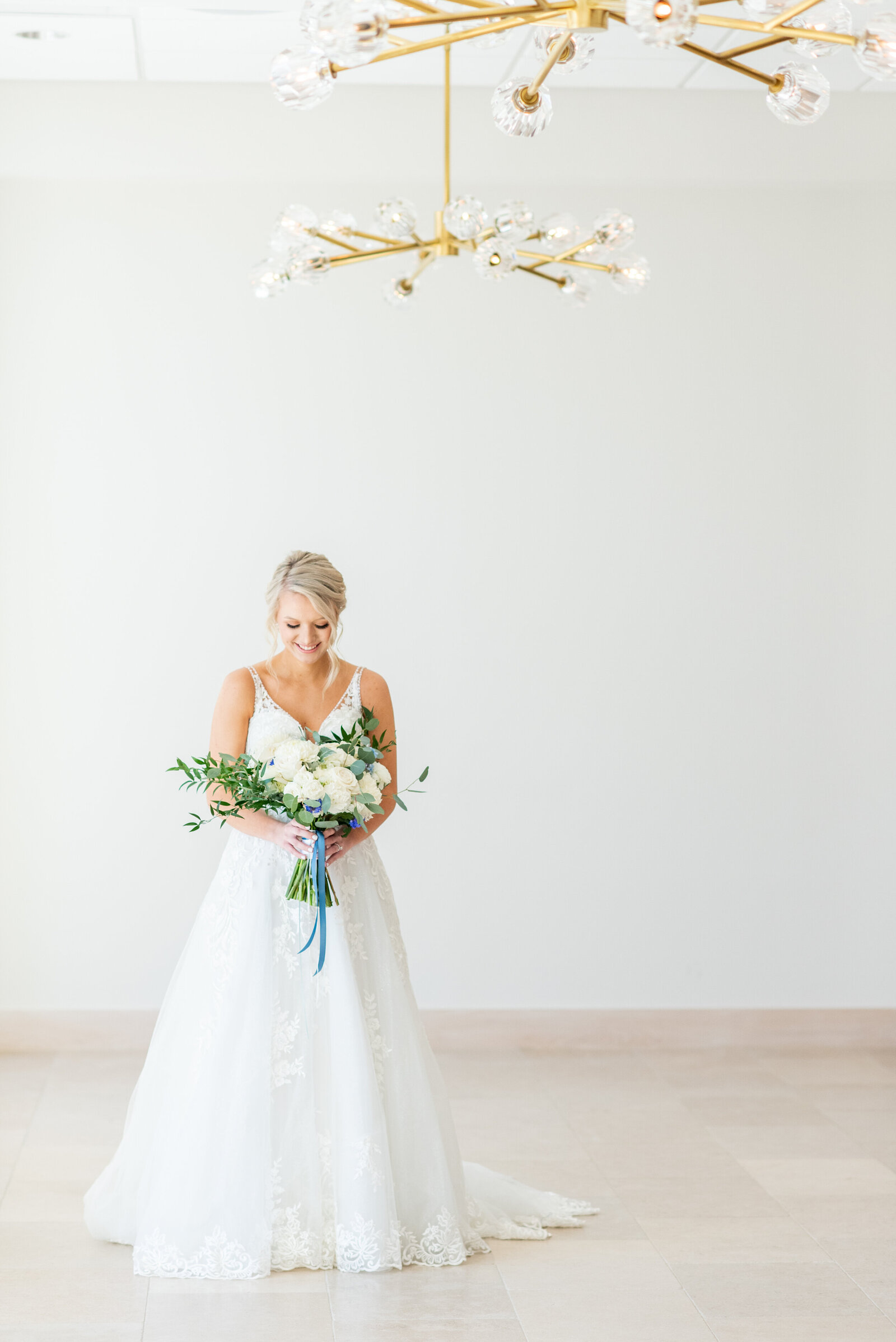 bride posing with flowers