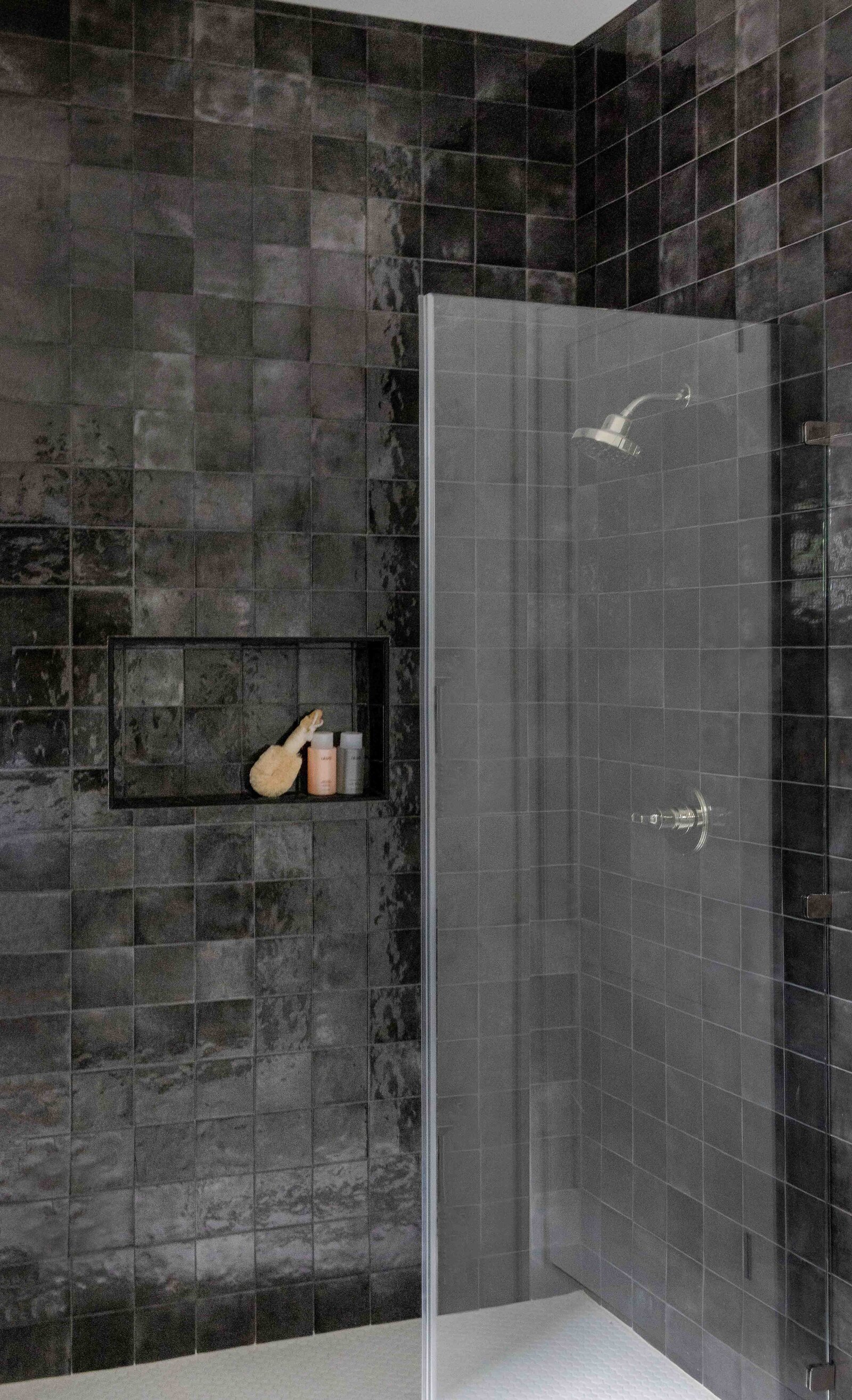 Nuela Designs Black Square Tile shower with White tile floor