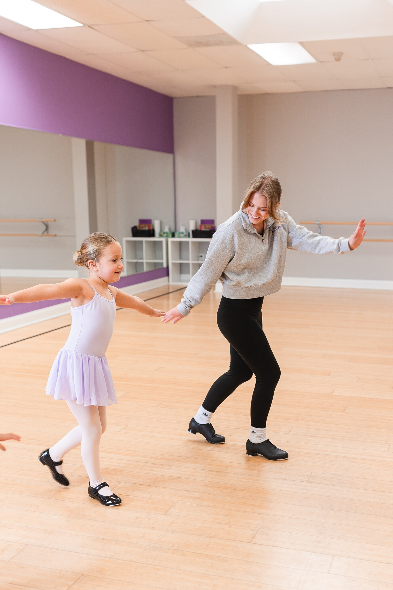 a tap teacher demonstrates and encourages their student
