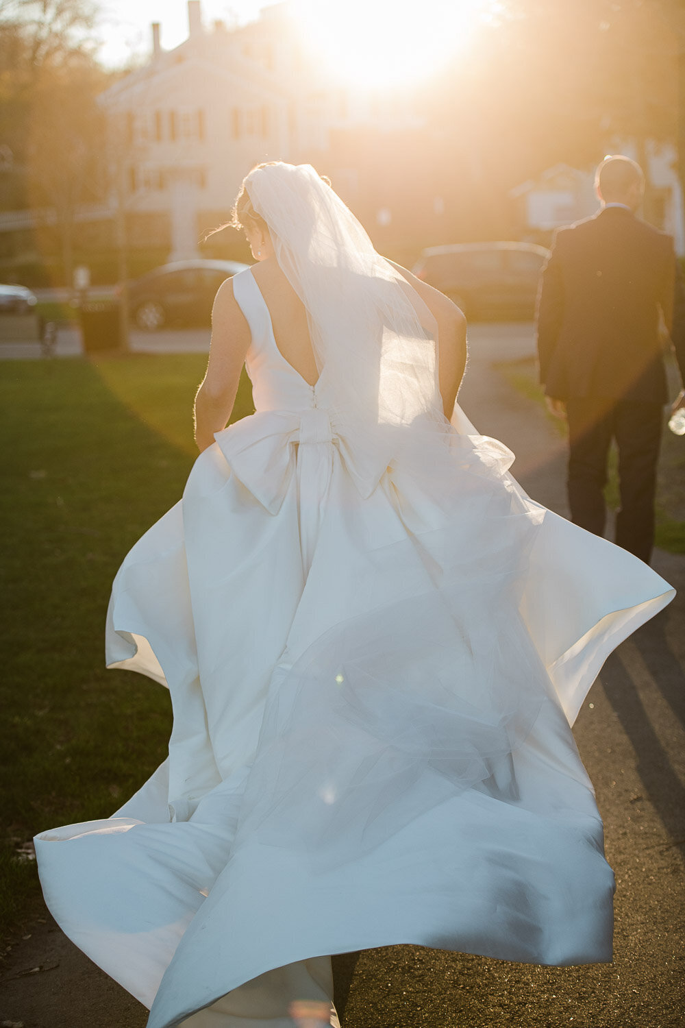 bride walking from behind in sun