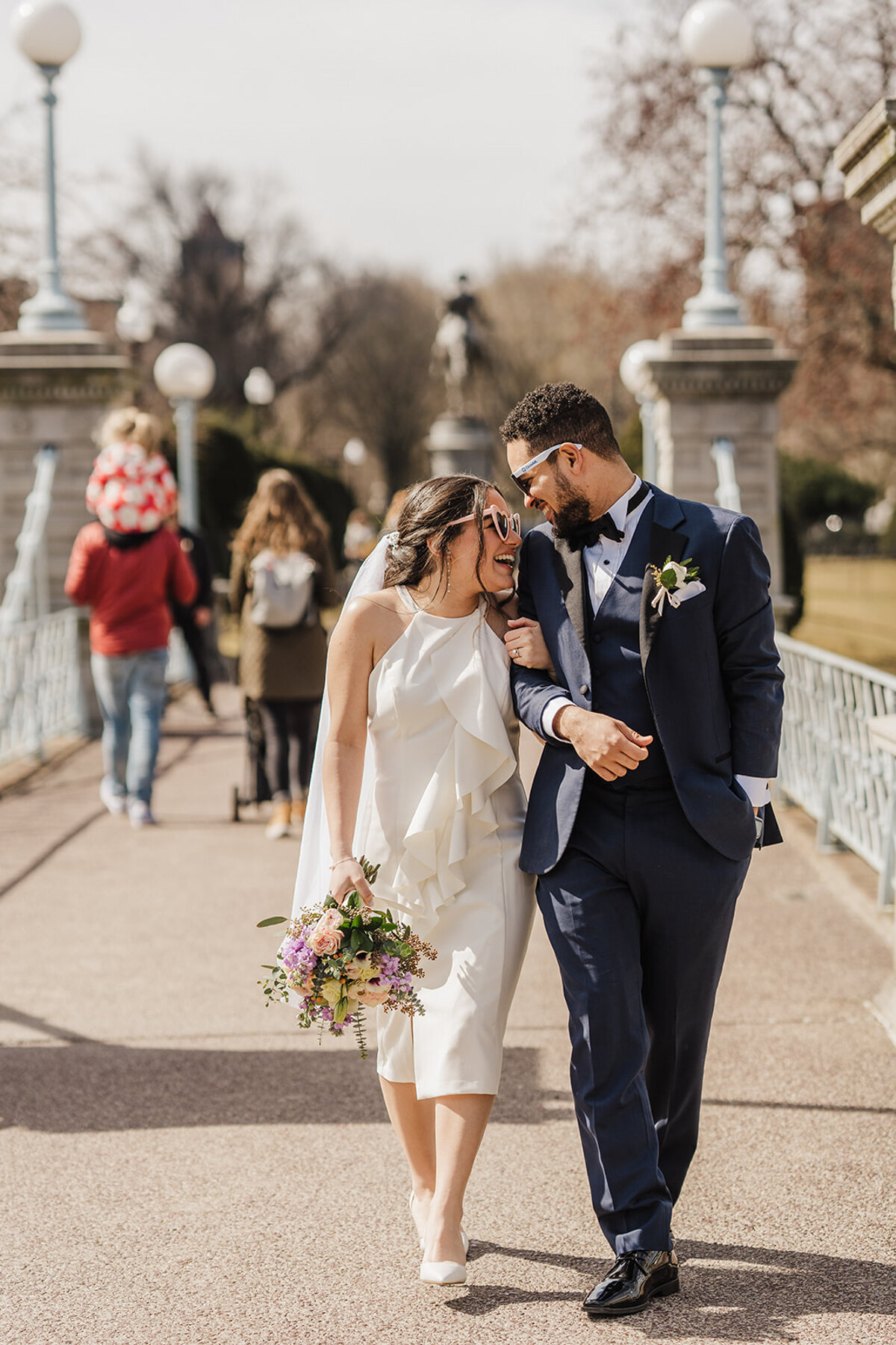 elopement couple walks across bridge in boston public garden