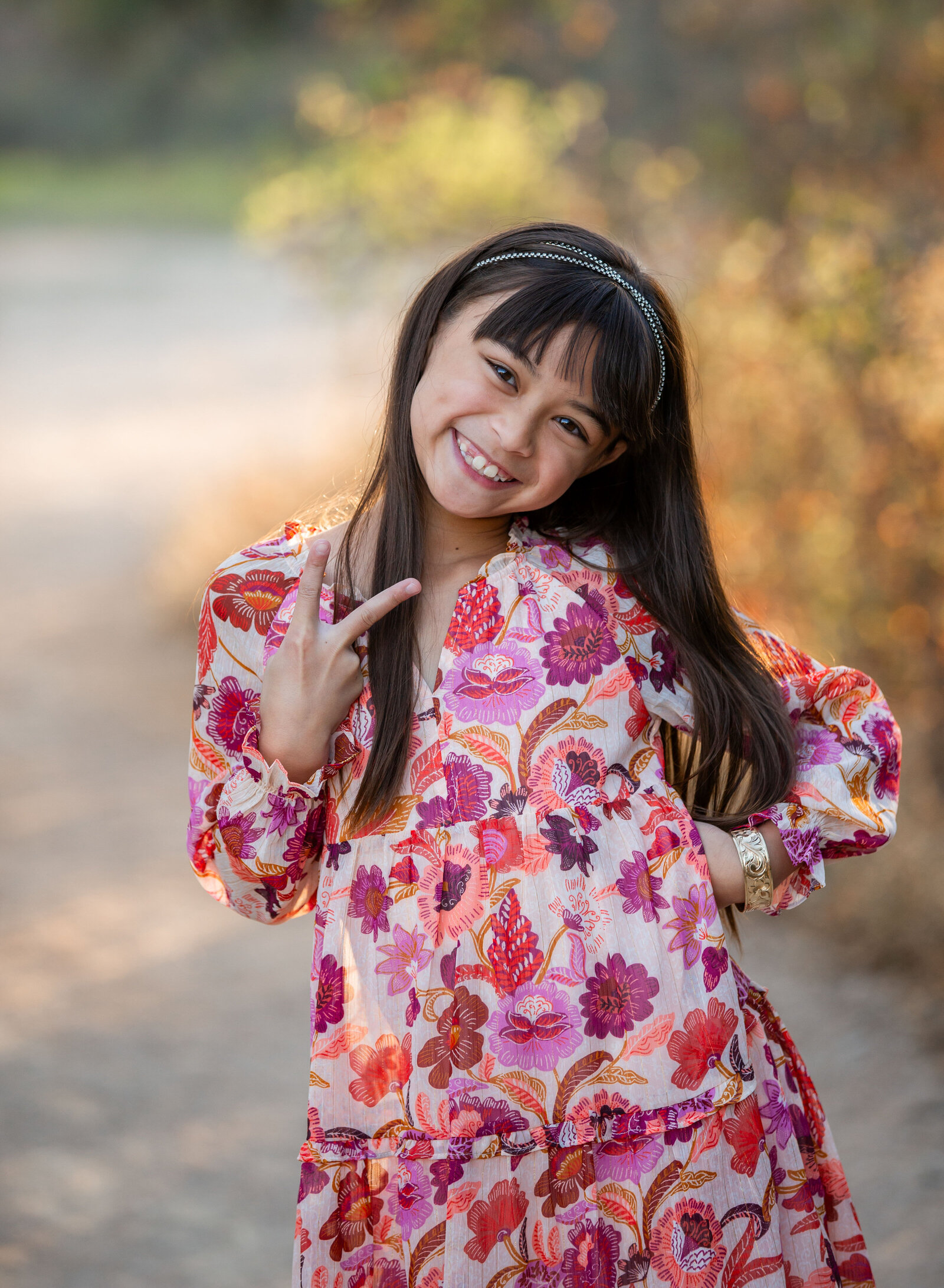 tween girl posing with peace sign