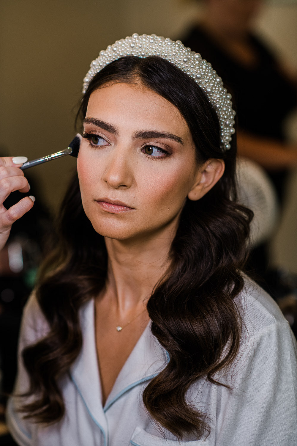 bride getting blush touch up