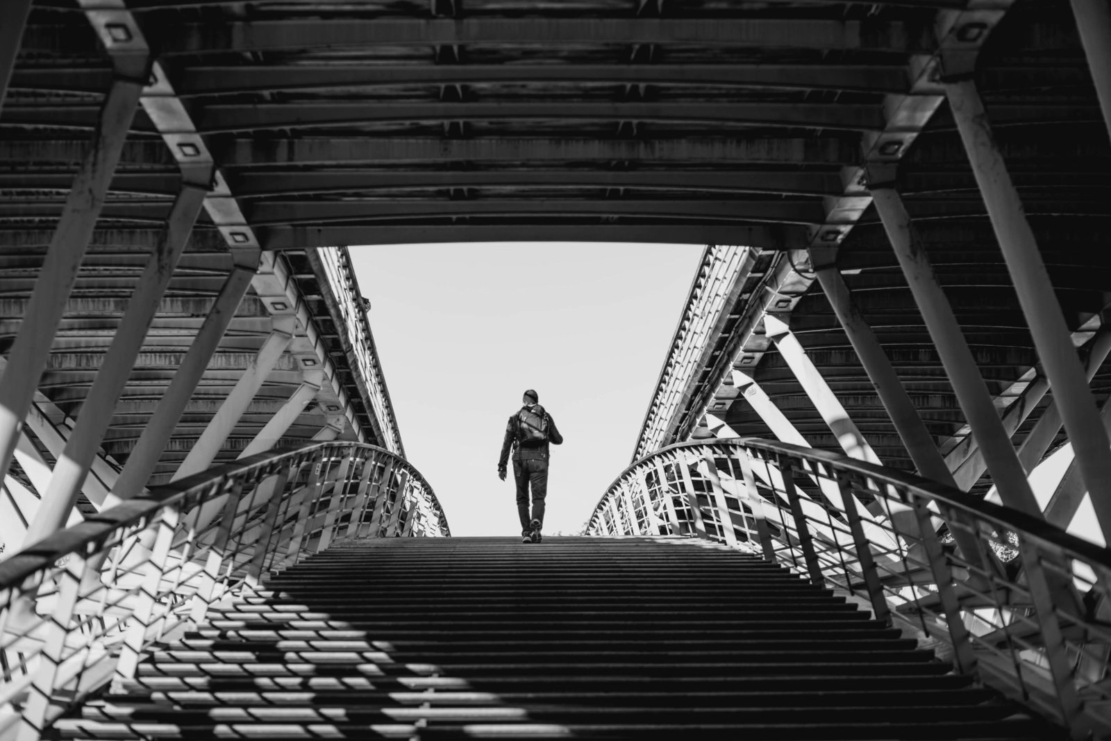 man-walking-bridge-paris-france-travel-destination-wedding-kate-timbers-photography-1818