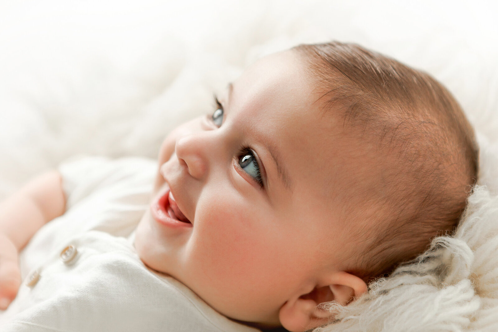 Close up image of 3month old baby boy smiling with one good shot photography in fresno, ca