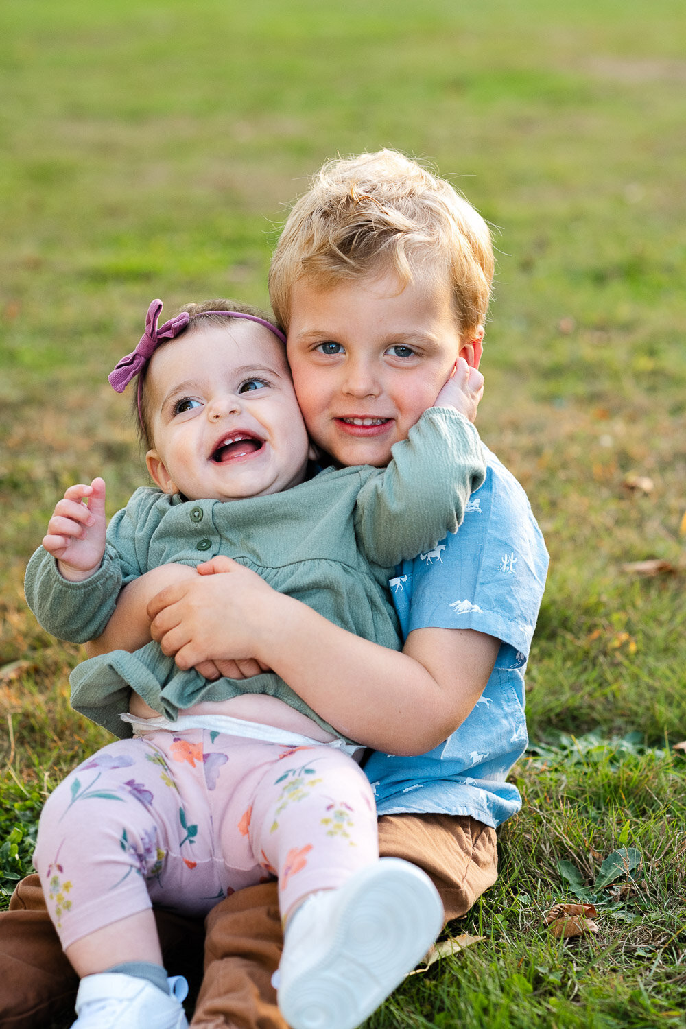brother and sister in grass